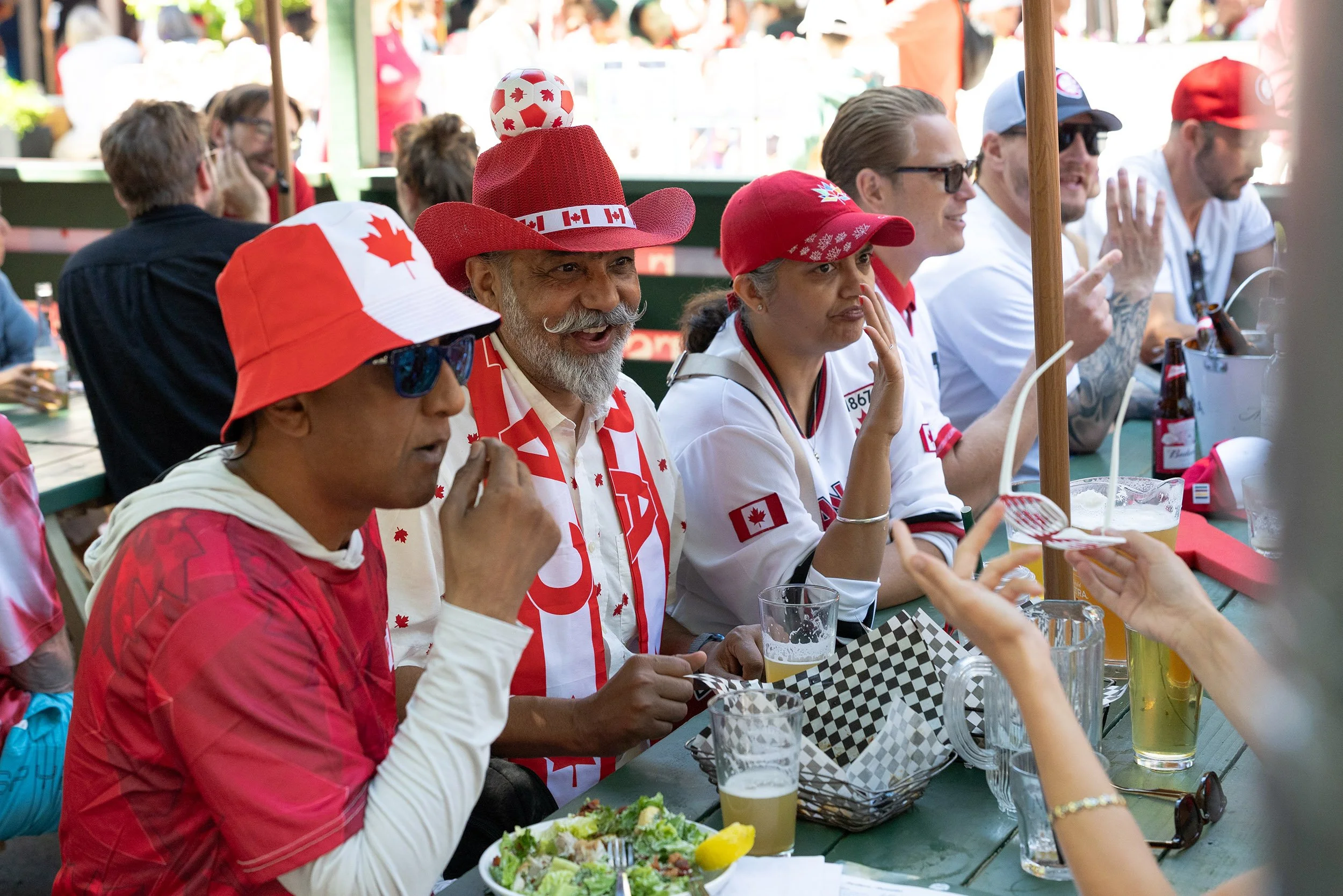 Canada Soccer fans dining on Granville Street, Vancouver. Sample image from a Sony FE 50-150mm f/2 GM and Sony A7 V.