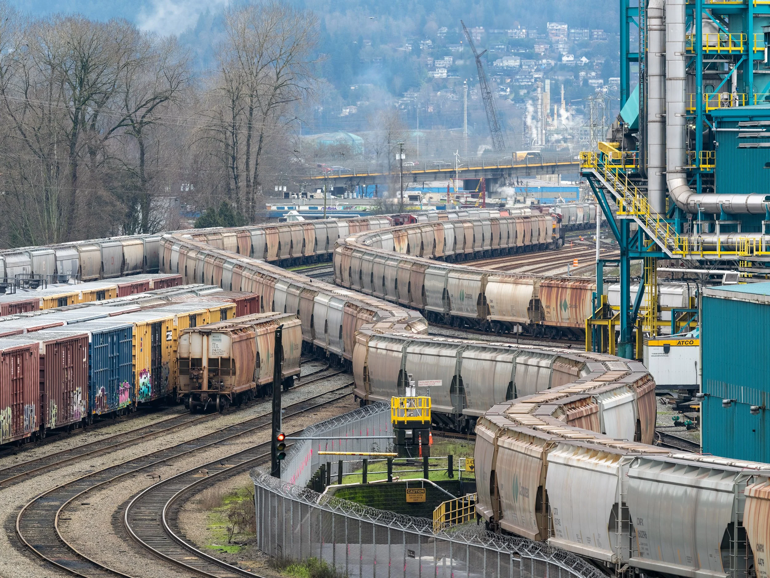 Train cars at North Vancouver Harbour. Sample image from a Fujifilm GF 500mm f/5.6 R LM OIS WR and Fujifilm GFX 100S II.