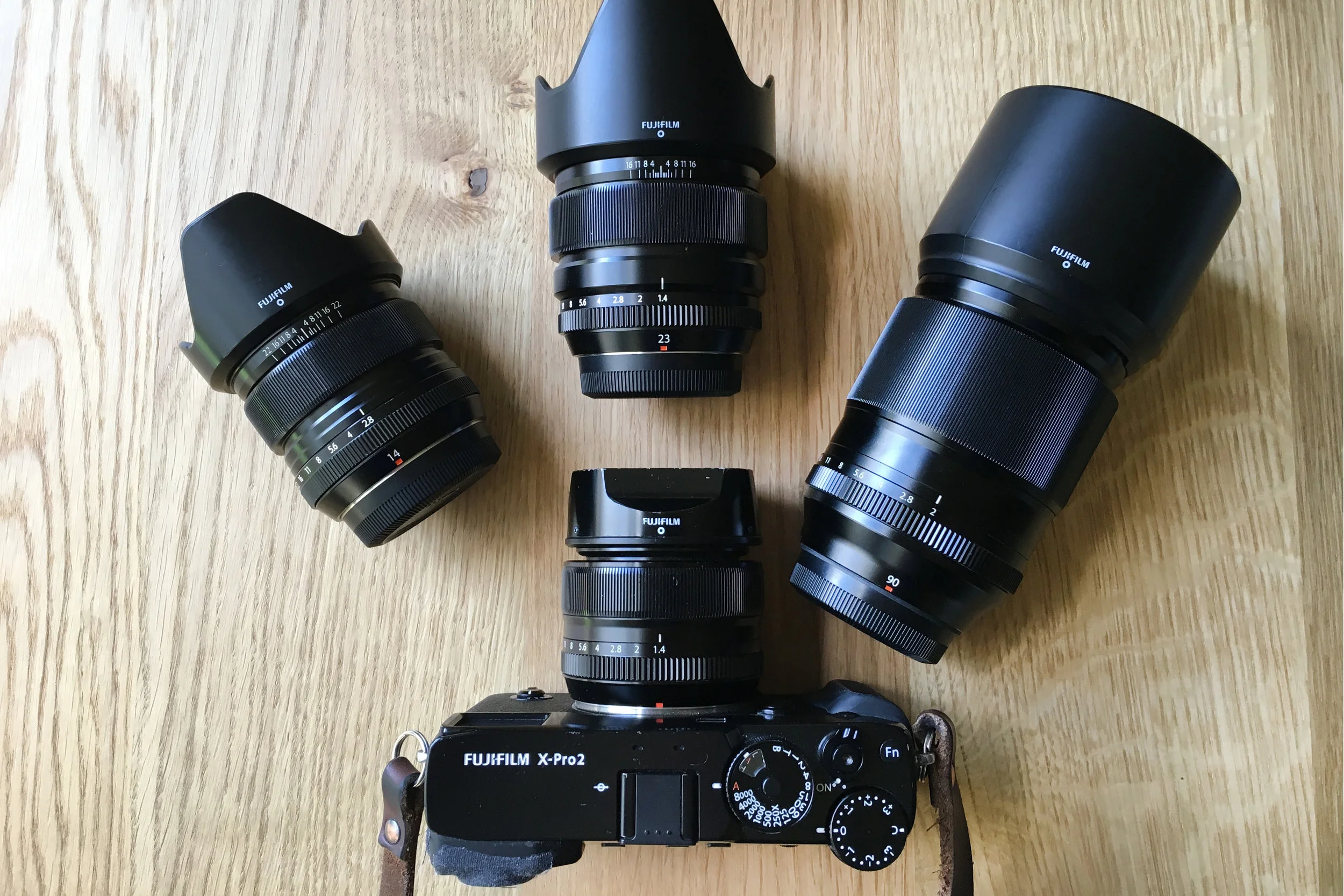 My current setup for travel. Fujifilm X-Pro with XF 35mm f/1.4 R mounted. From left to right; XF 14mm f/2.8 R , XF 23mm f/1.4 R , XF 90mm f/2 R WR