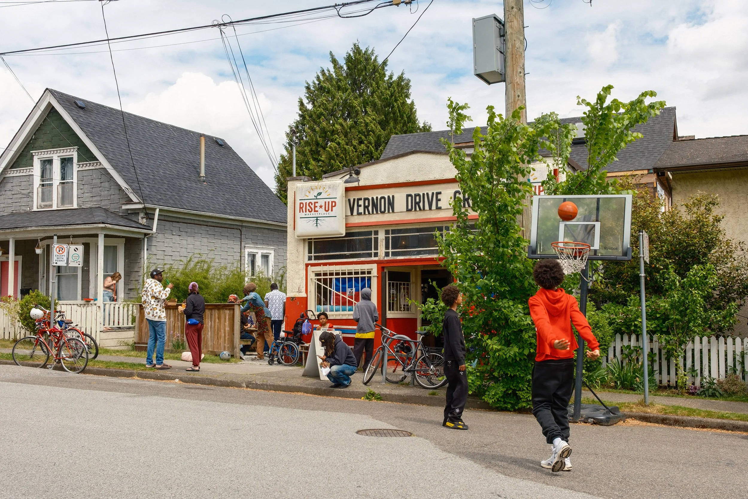 Kids are playing basket ball by the Vernon Drive Grocery store in Vancouver. Sample image from a Fujifilm XF 16-50mm f/2.8-4.8 R LM WR and Fujifilm X-T50.
