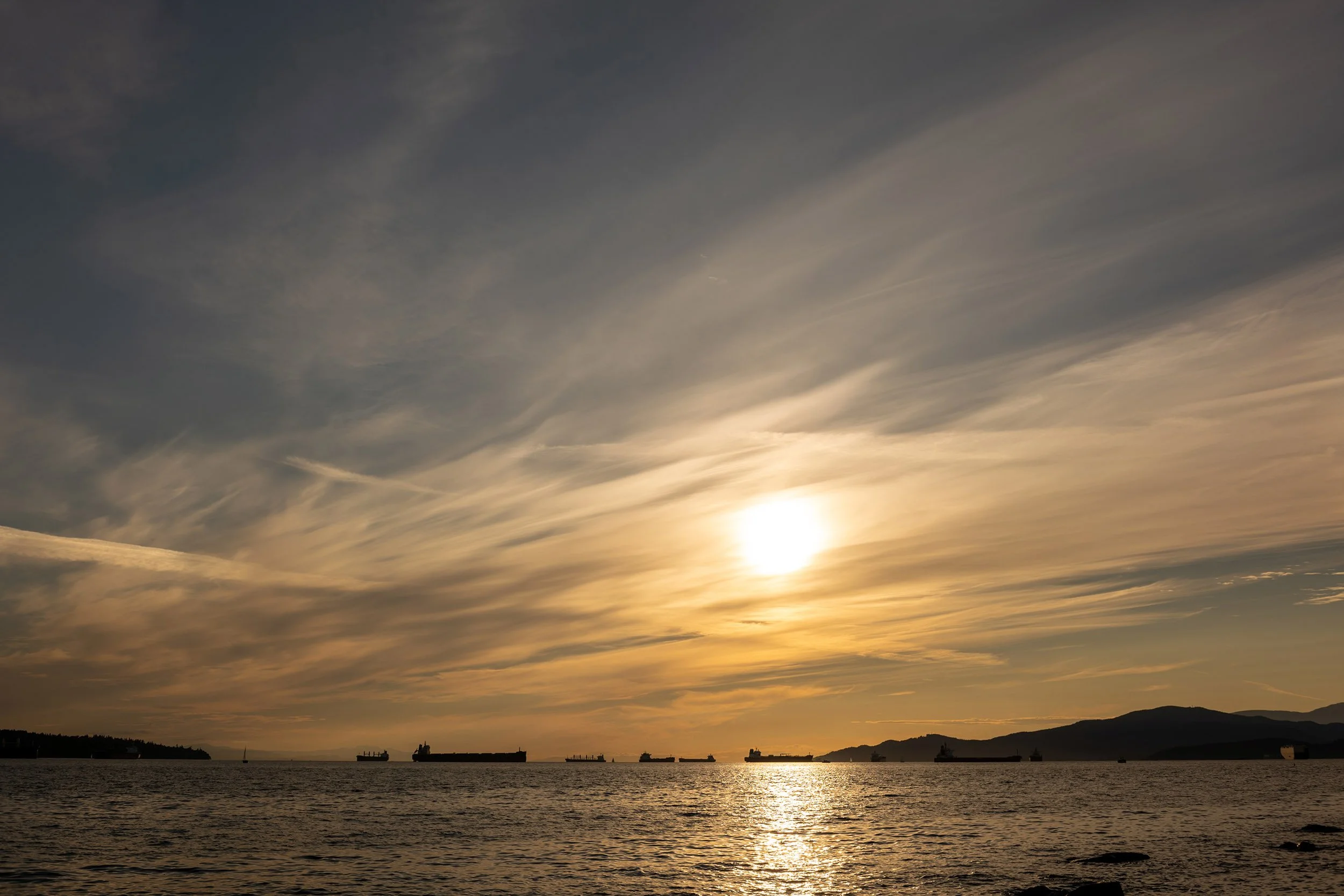 August sunset at English Bay Beach in Vancouver. Sample image from a Voigtländer Nokton Classic 35mm f/1.4 II MC and Leica SL2-S.