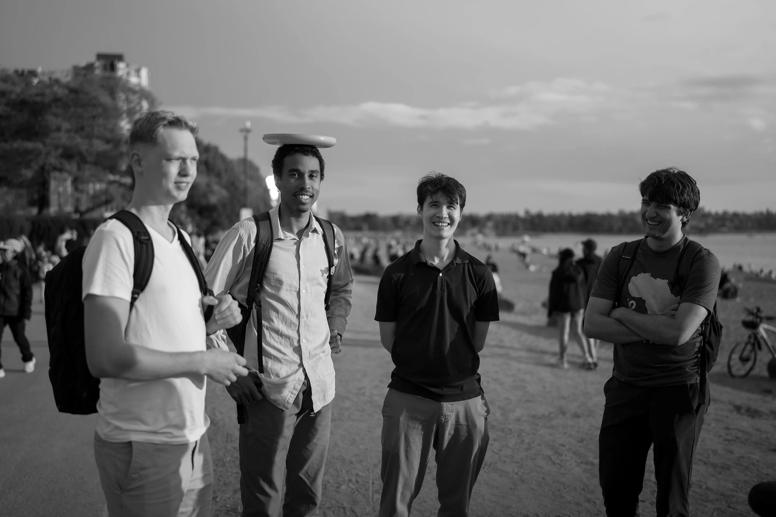 A group of young men at English Bay Beach, May 23 2026. Sample image from a Sigma 35mm f/1.4 DG II Art.