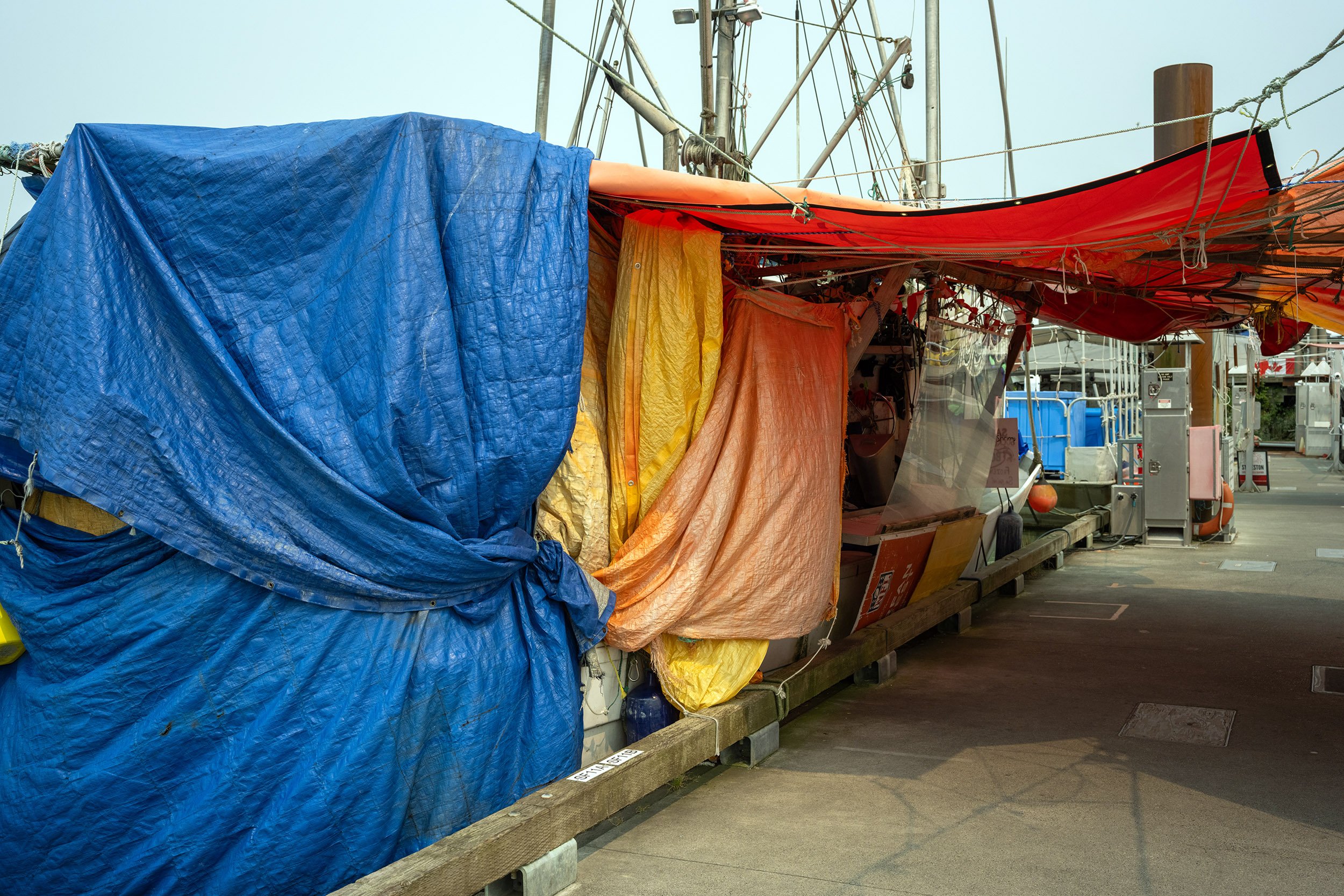 Tarps on Steveston Harbour. Sample image from a Sony A7R VI and Sigma 35mm f/1.4 DG II Art.
