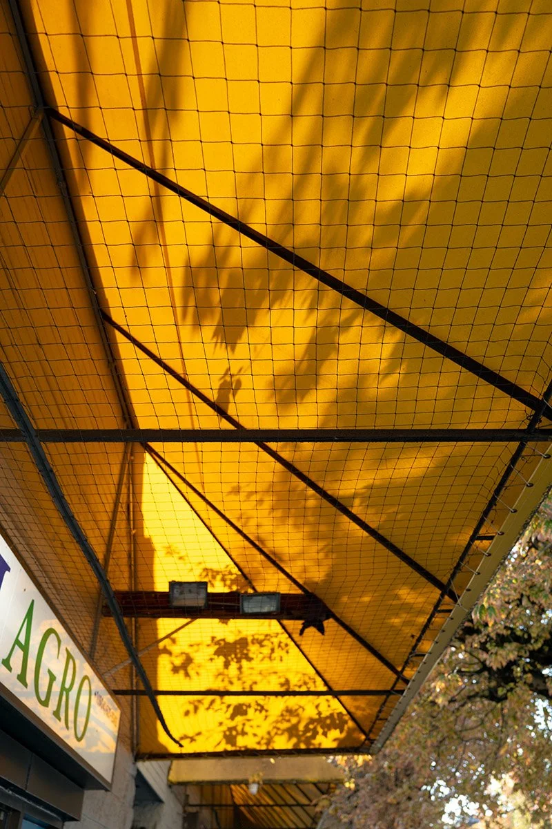 A yellow awning on Kingsway in Vancouver. Sample image from a Leica Q Typ 116.