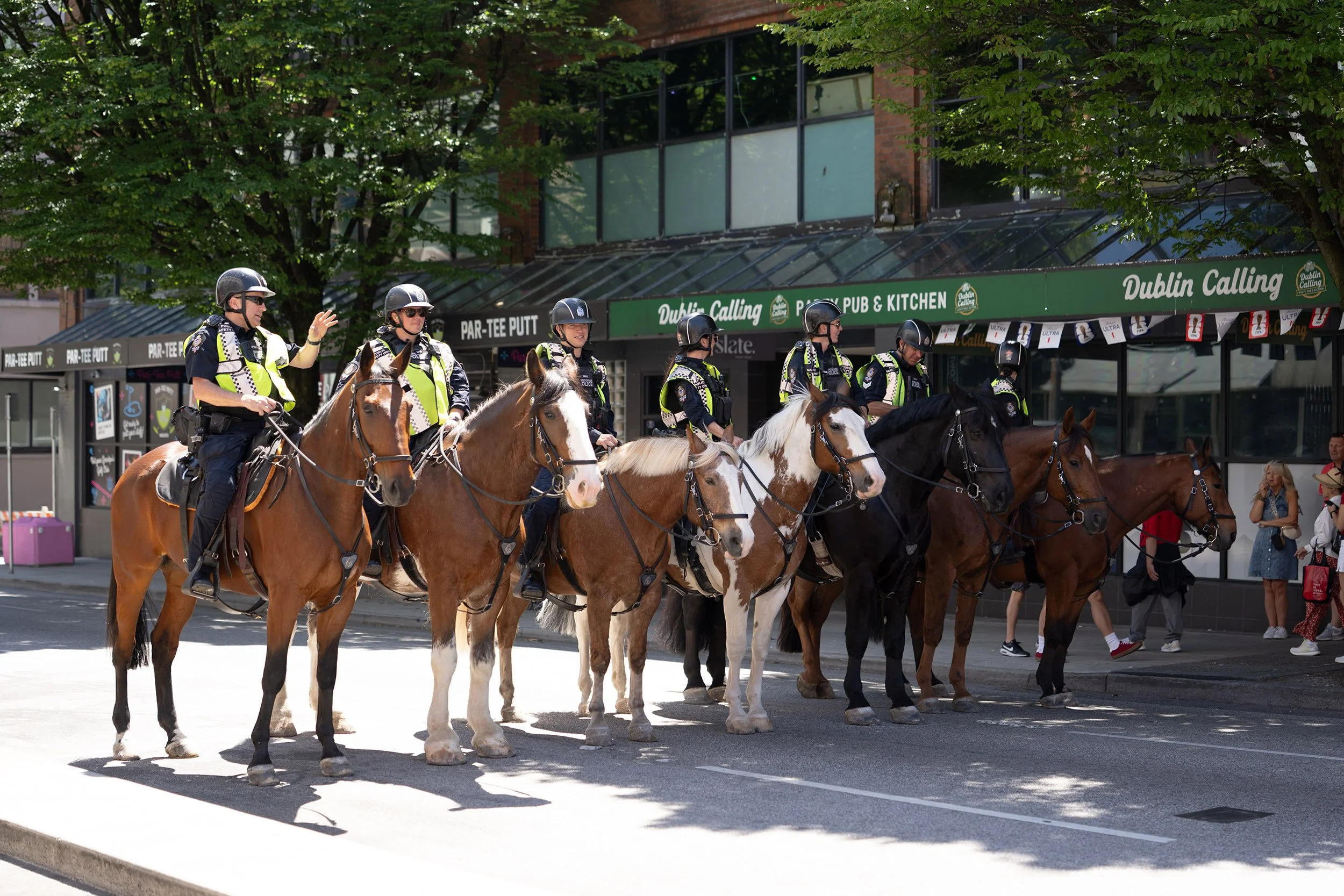 The RCMP on horseback at Granville Street in Vancouver during the FIFA World Cup. Sample image from a Sony FE 50-150mm f/2 GM and Sony A7 V.