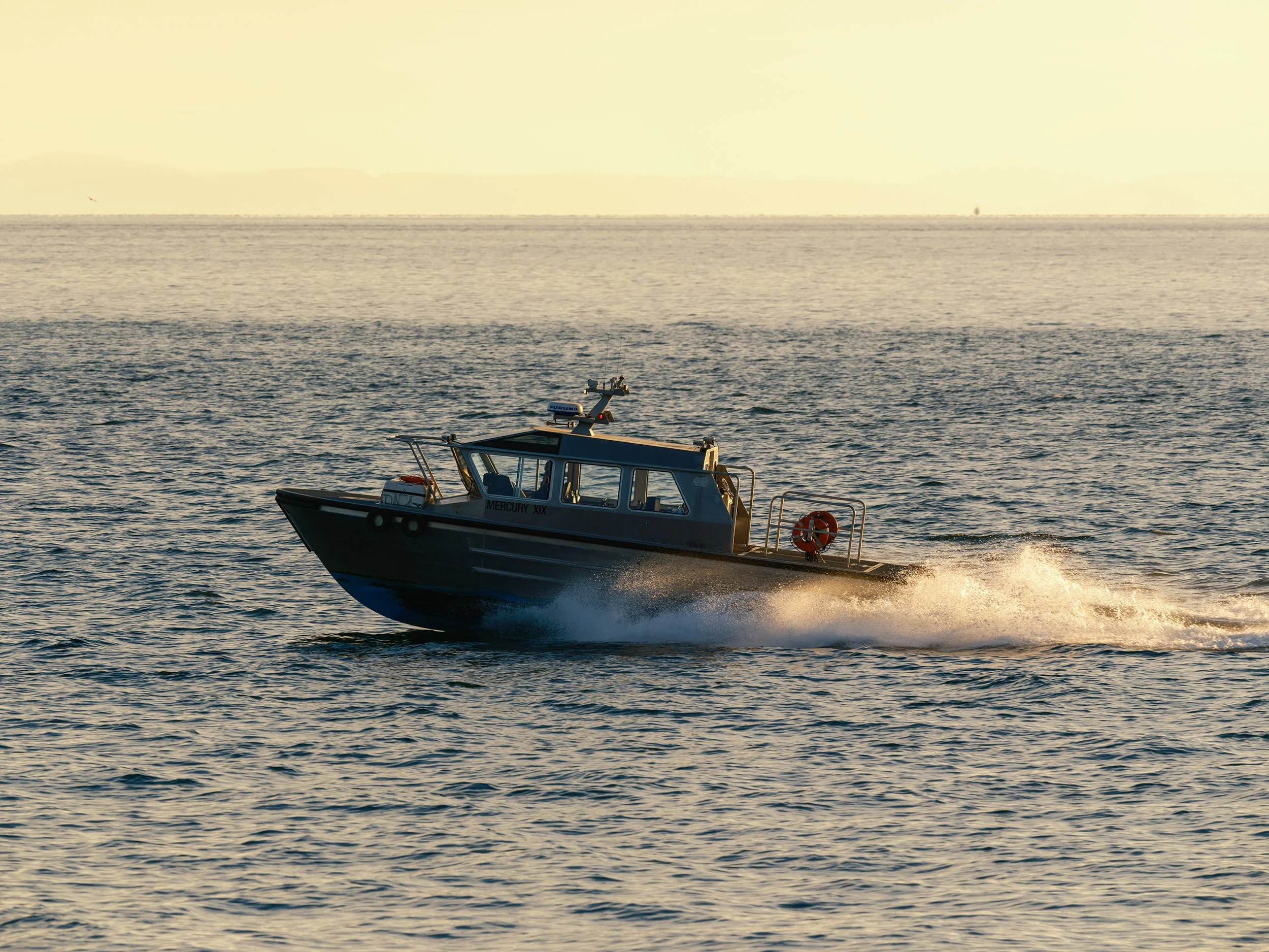 Speed boat on Howe Sound near Vancouver. Sample image from a Fujifilm GF 500mm f/5.6 R LM OIS WR and Fujifilm GFX 100S II.