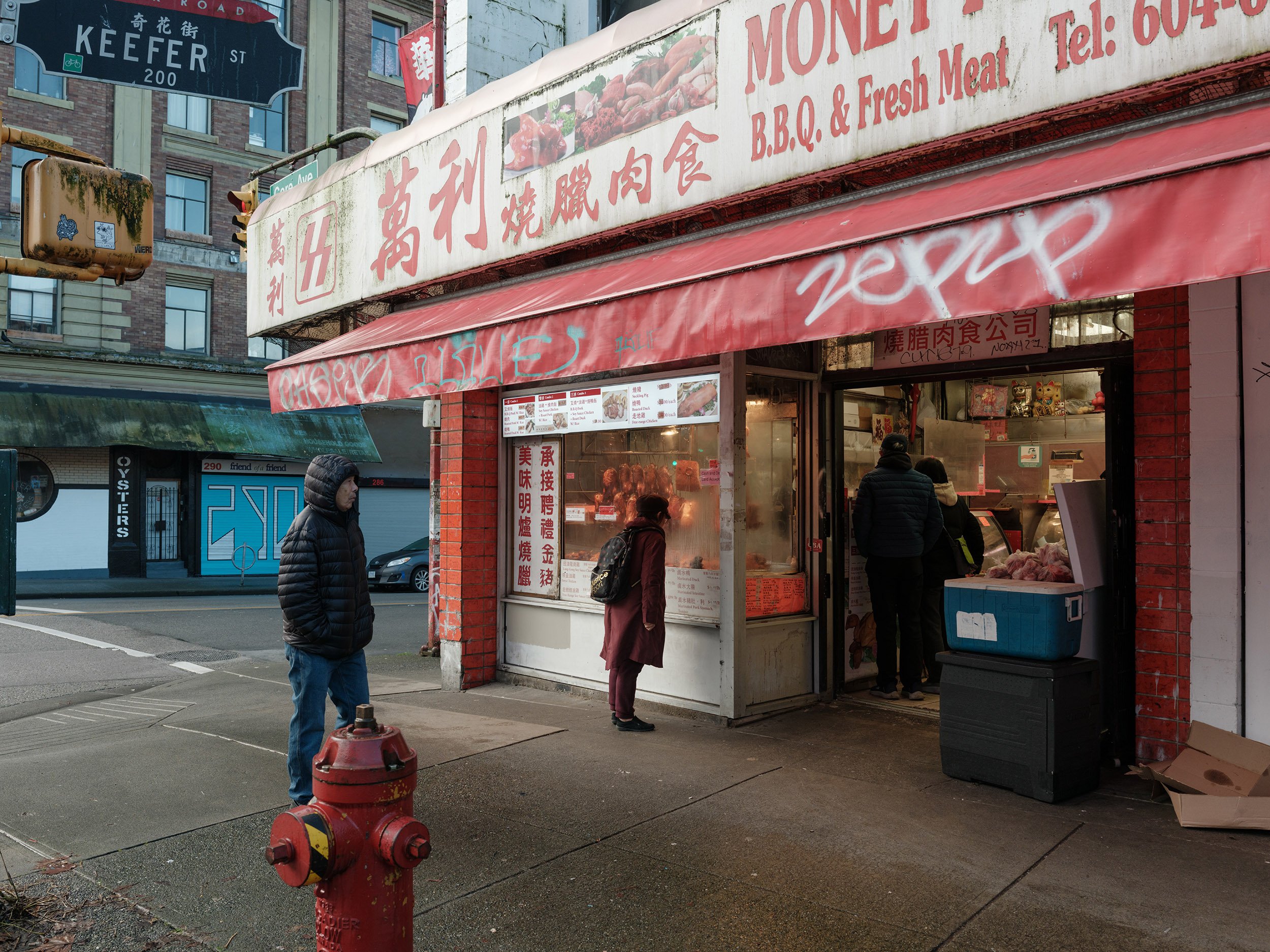 People shopping in Chinatown, Vancouver on Christmas Day. Sample image from a Fujifilm GFX 100RF.