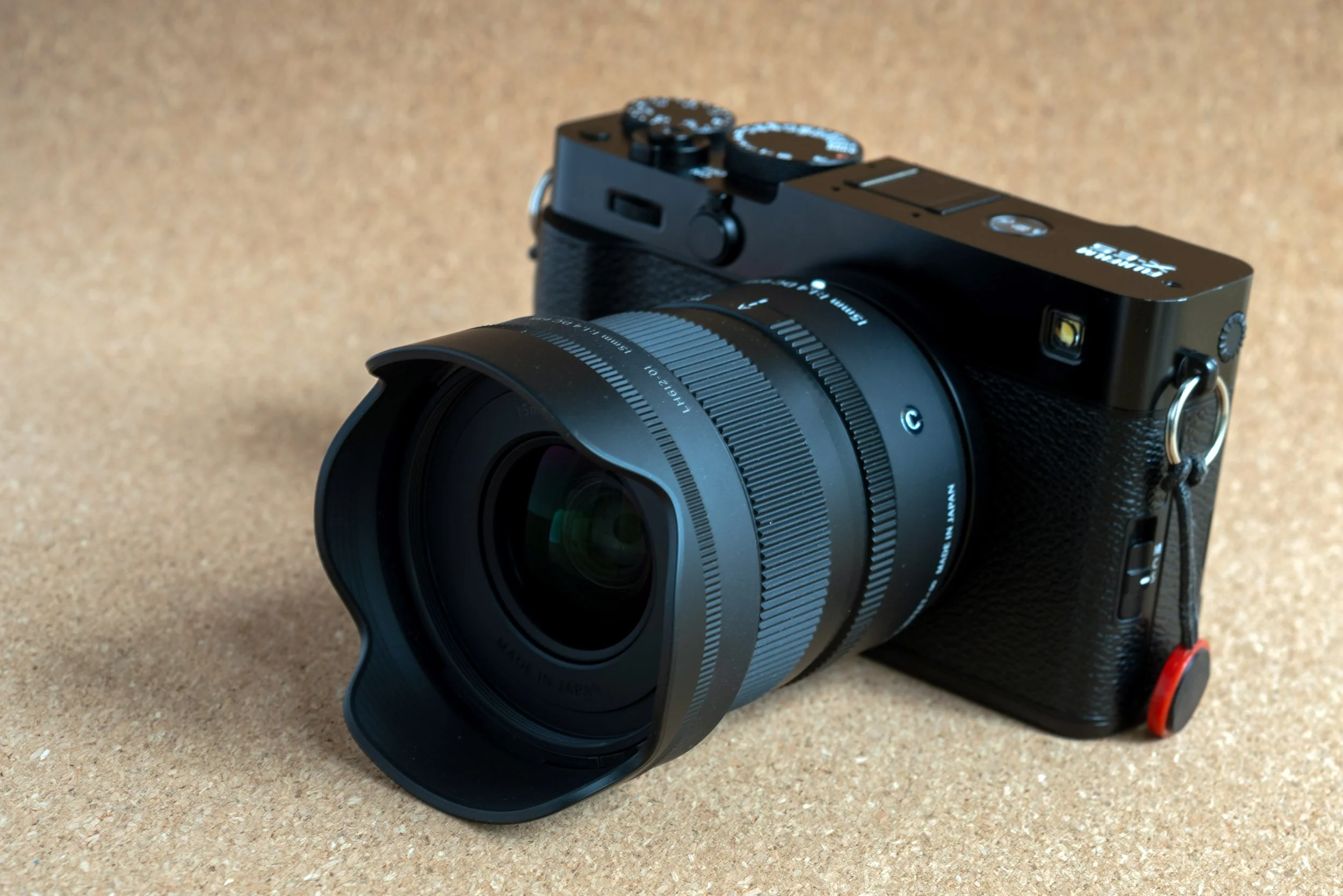 The Sigma 15mm f/1.4 DC Contemporary with the hood shown on a Fujifilm X-E5
