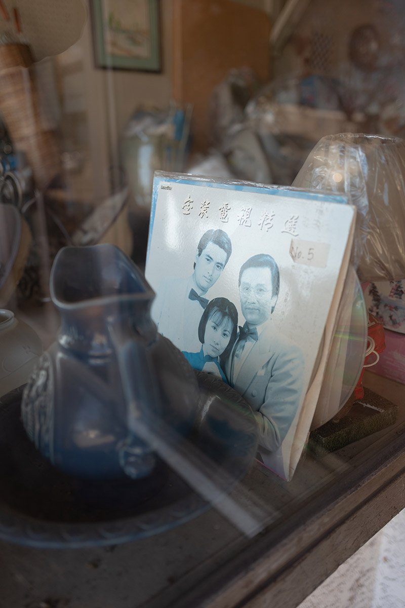 Album cover in a window display along Kingsway in Vancouver. Sample image from a Leica Q Typ 116.