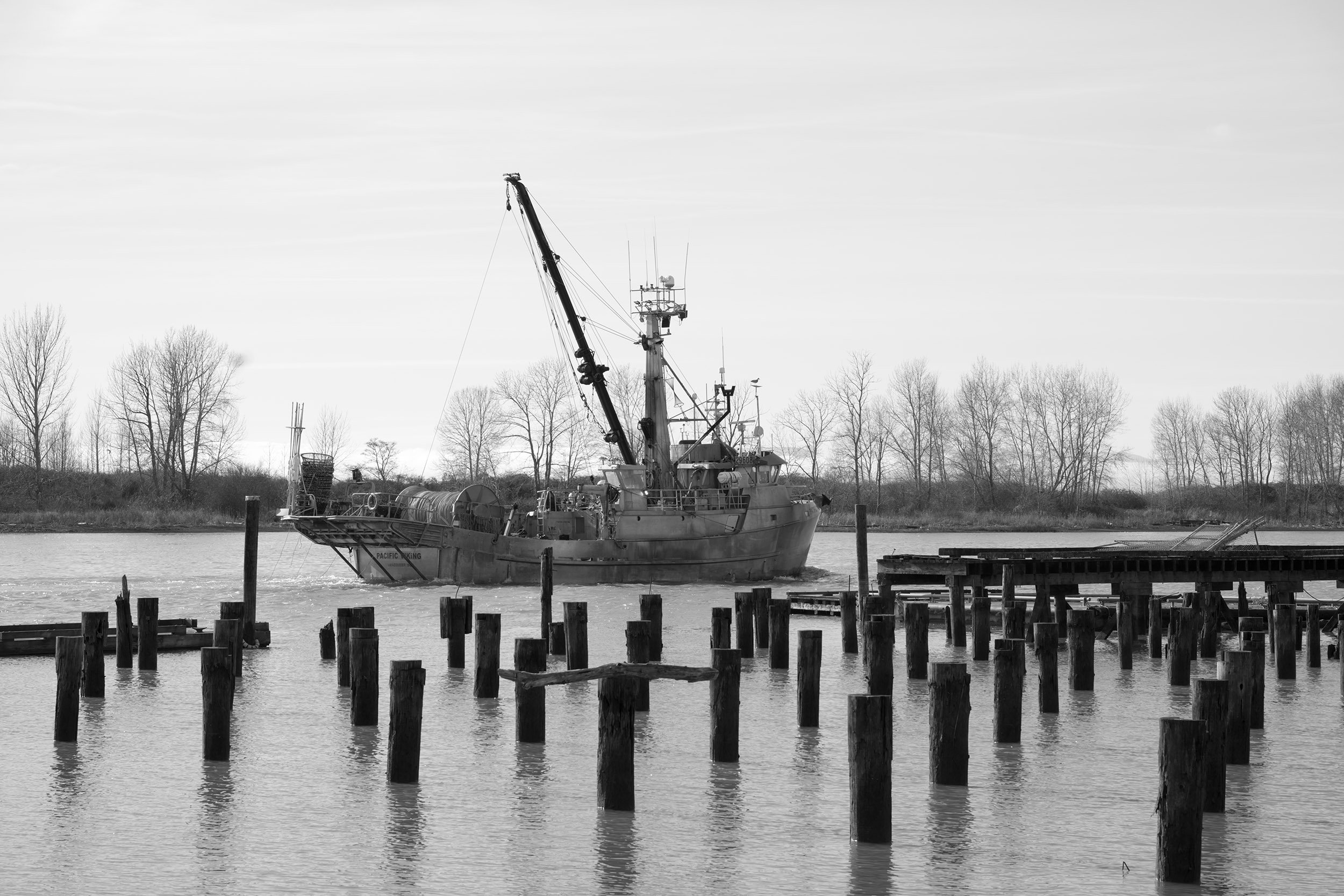 A fishing boat in Steveston is off to sea. Sample image from a Sony A7V and Sony FE 85mm f/1.4 GM II.