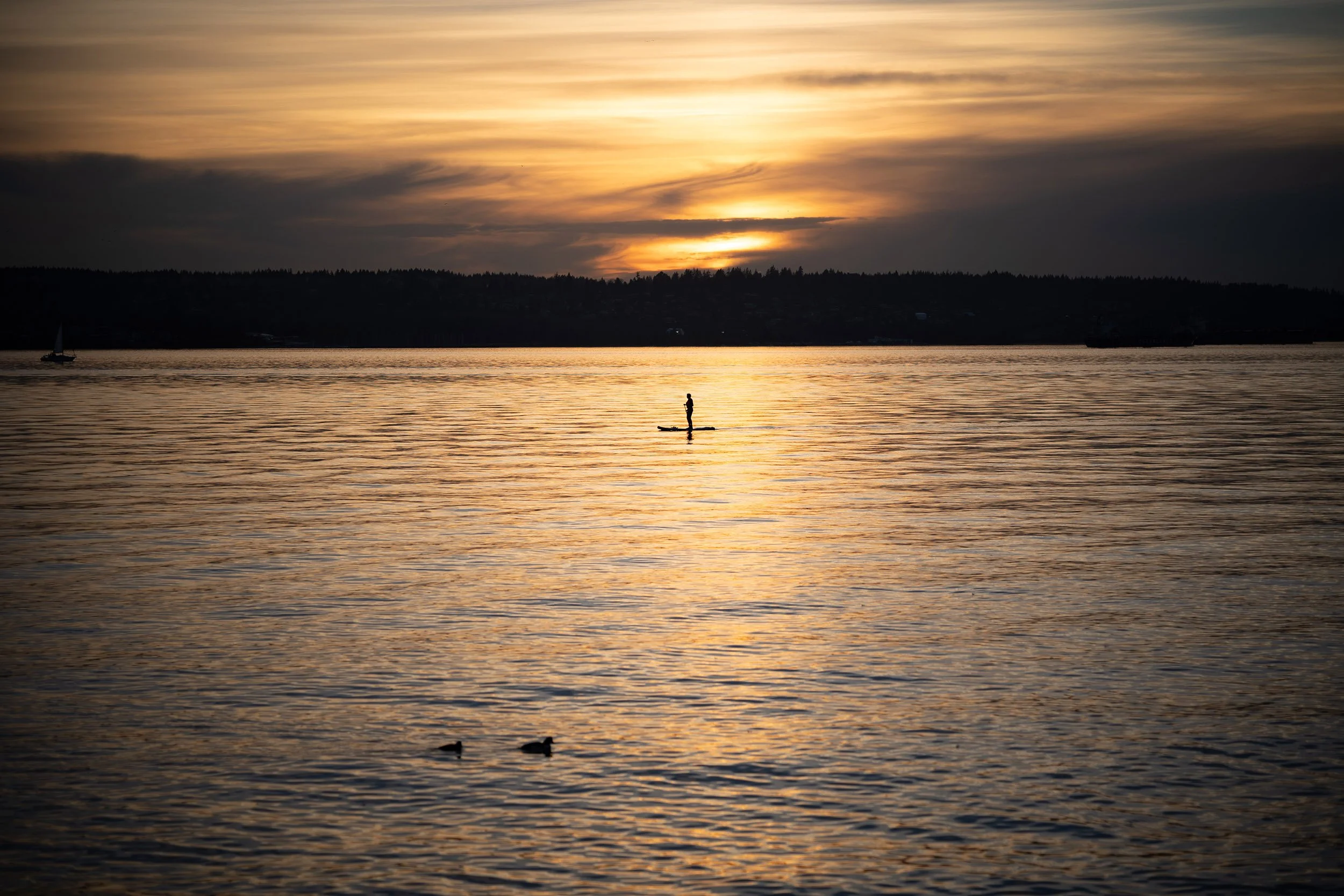 A paddle boarder on English in February