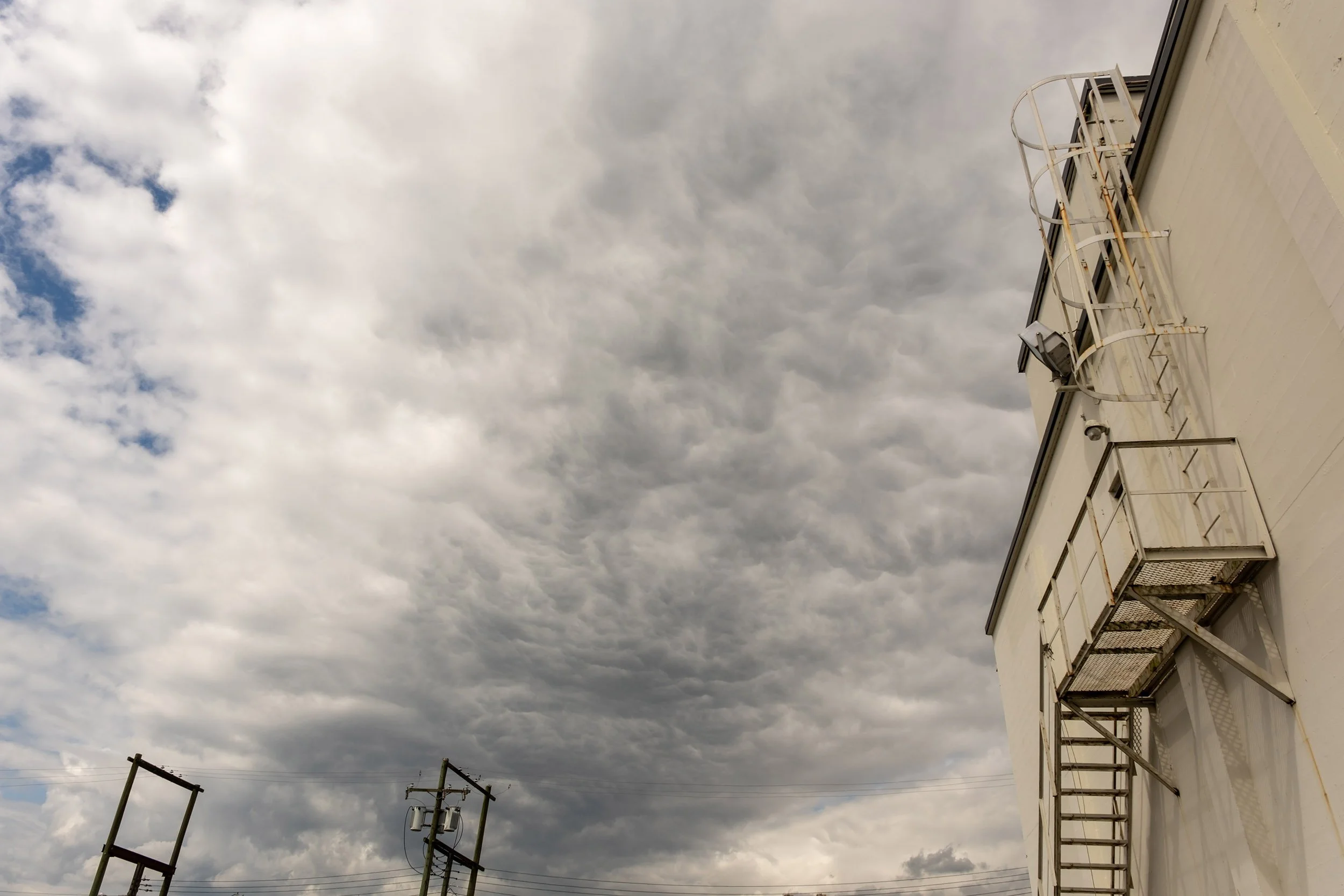 Dark clouds over East Vancouver. Sample image from a Fujifilm XF 16-50mm f/2.8-4.8 R LM WR and Fujifilm X-T50.