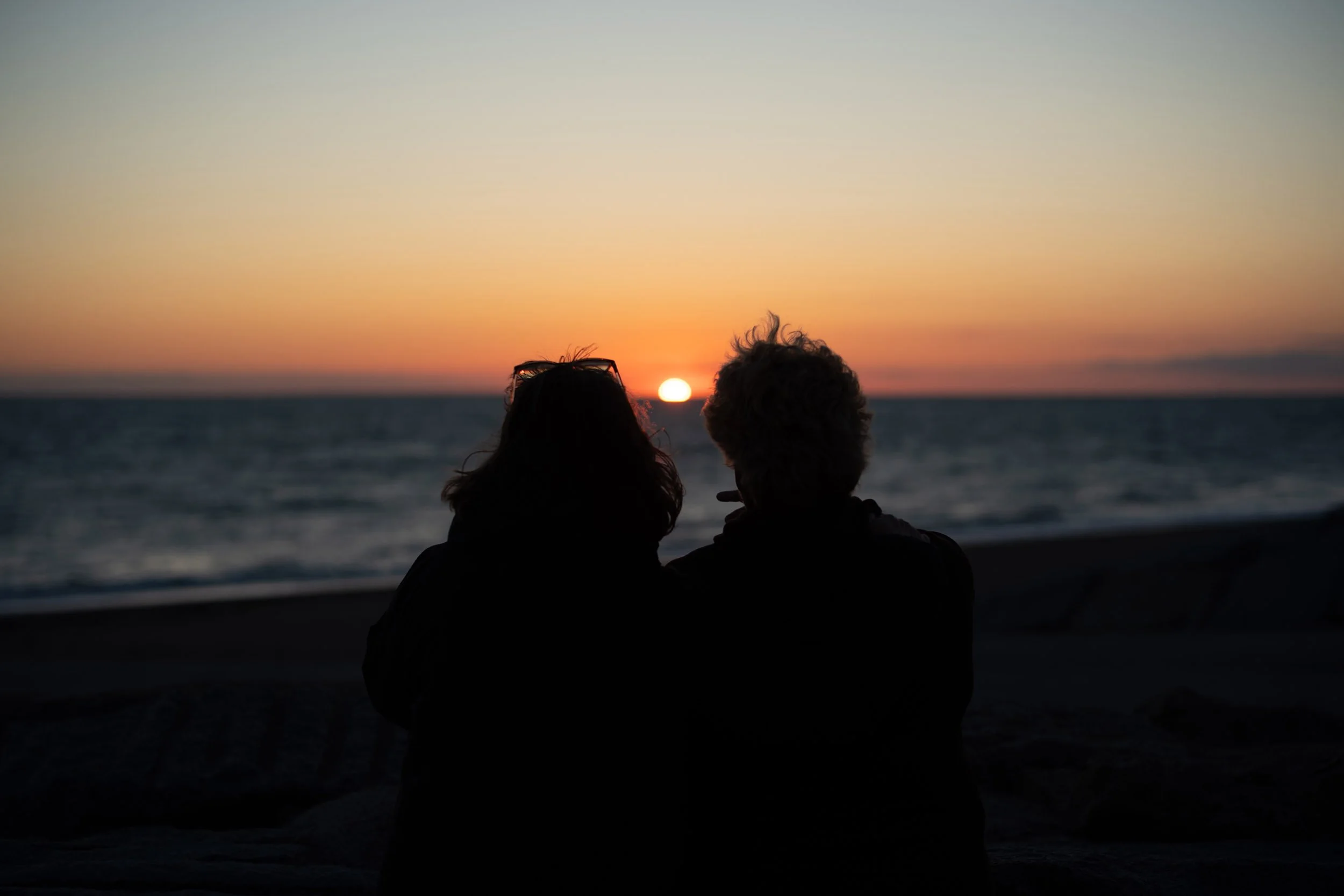 Two friends at Agon-Coutainville, France, at sunset