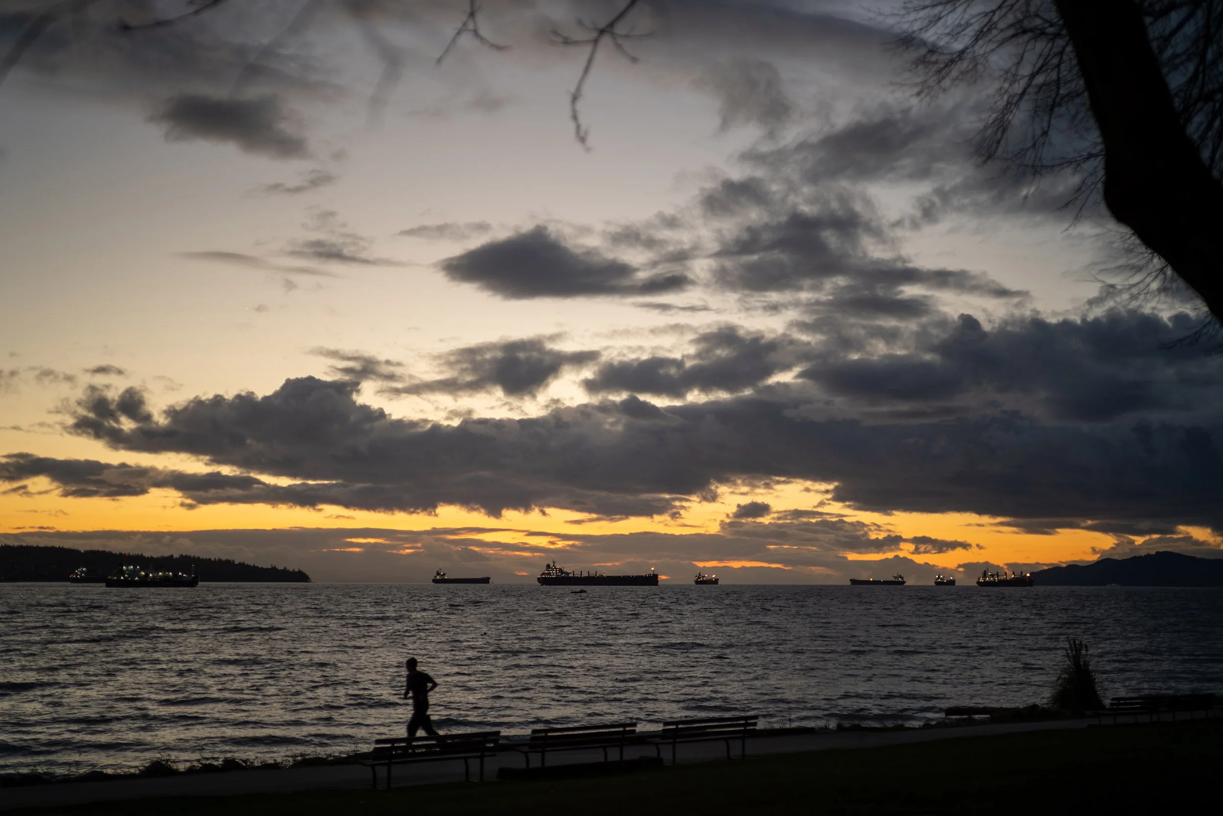 Evening runner at English Bay, March 2026