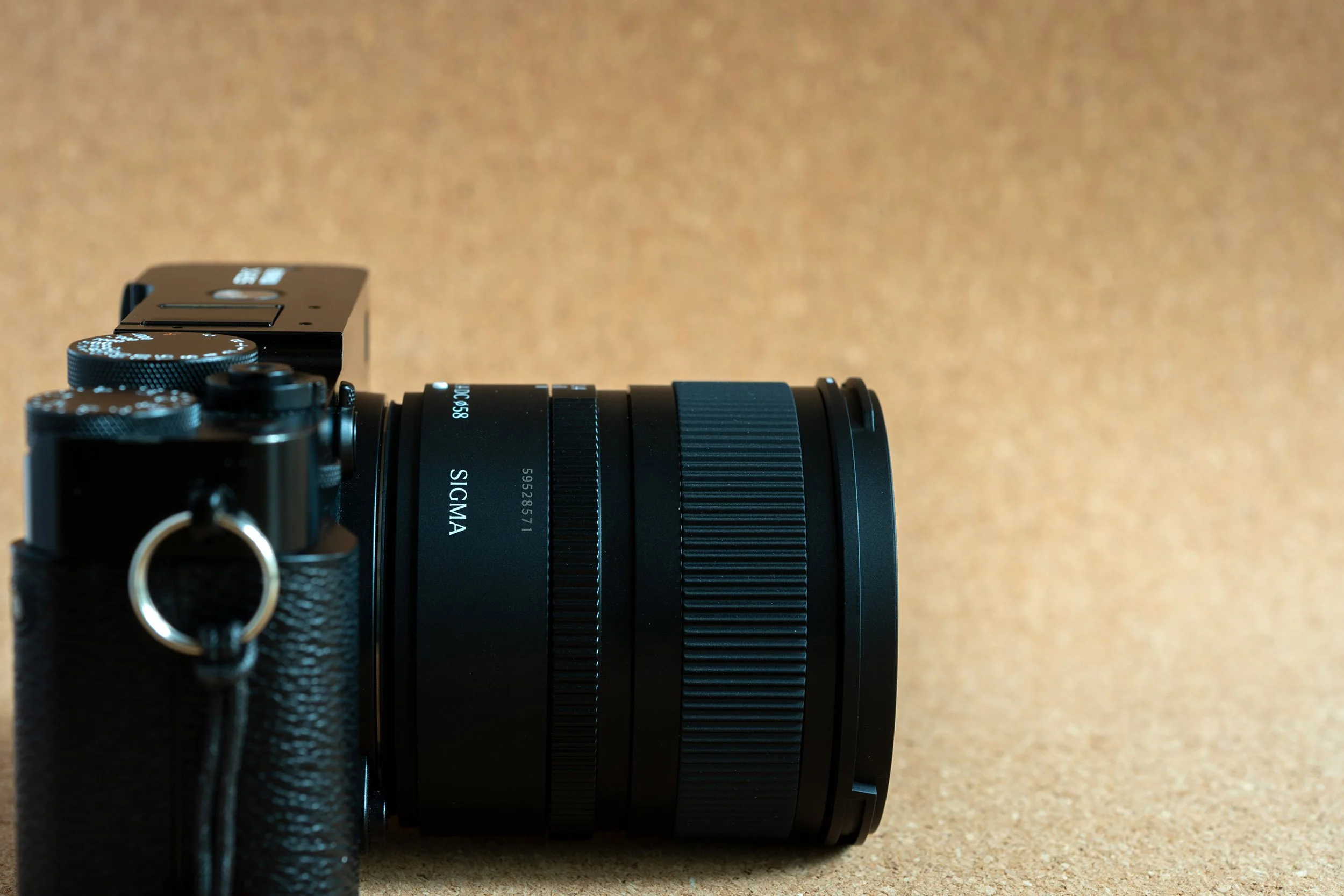 Sigma 15mm f/1.4 DC Contemporary mounted on a black Fujifilm X-E5