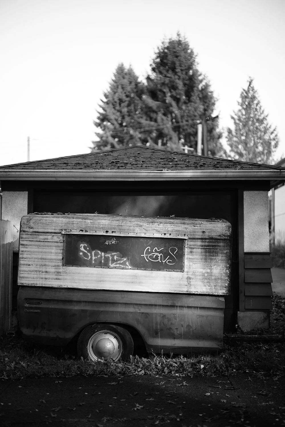 A trailer parked in front of a garage in Vancouver. Sample image from a Voigtländer Nokton 50mm f/1.2 Aspherical and Nikon Zf.