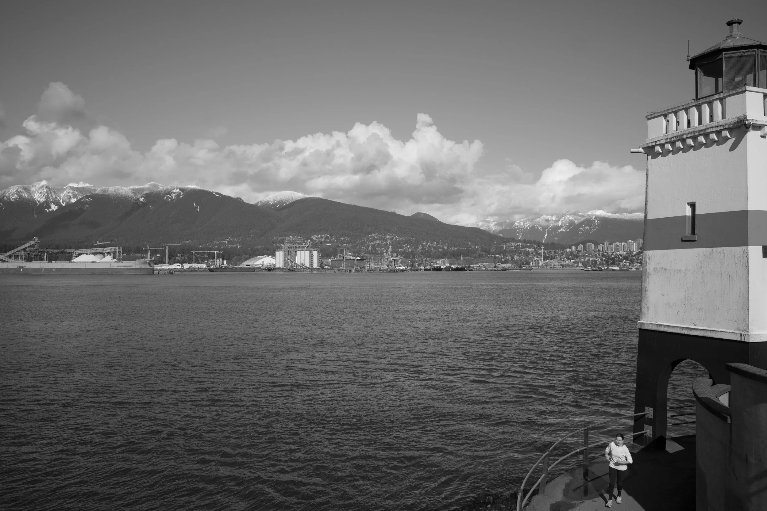 A runner at Brockton Point Lighthouse, Burrard Inlet, Vancouver. Sample image from a Voigtländer Nokton Vintage Line 28mm f/1.5 (M-Mount) and Leica SL2-S.