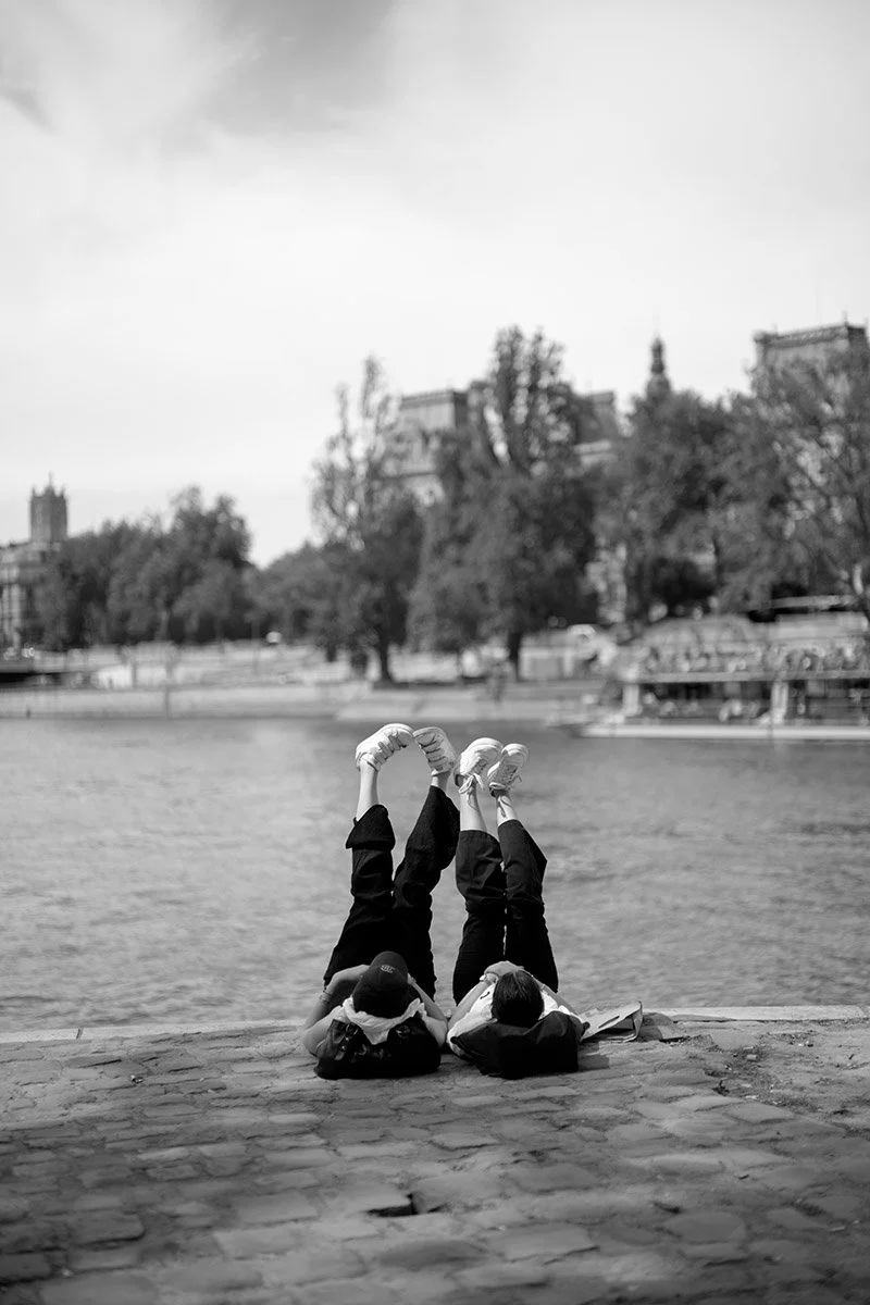 Playful friends along the Seine in Paris, France
