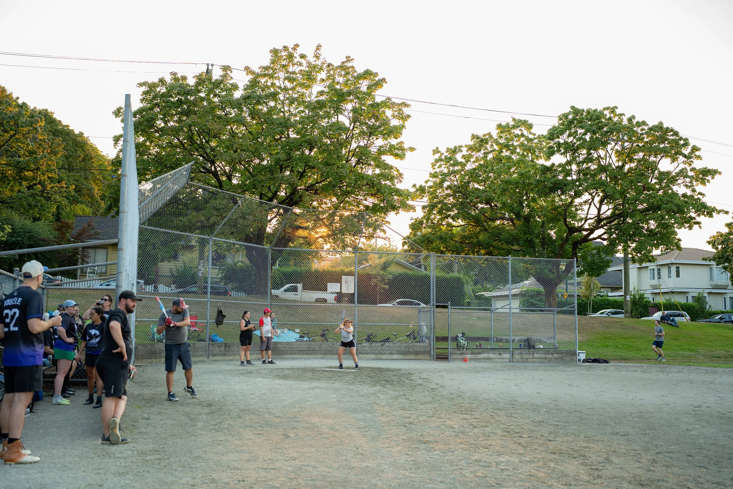 Evening baseball game at Douglas Park in Vancouver. Sample image from a Sigma 35mm f/1.4 DG II Art and Sony A7V.