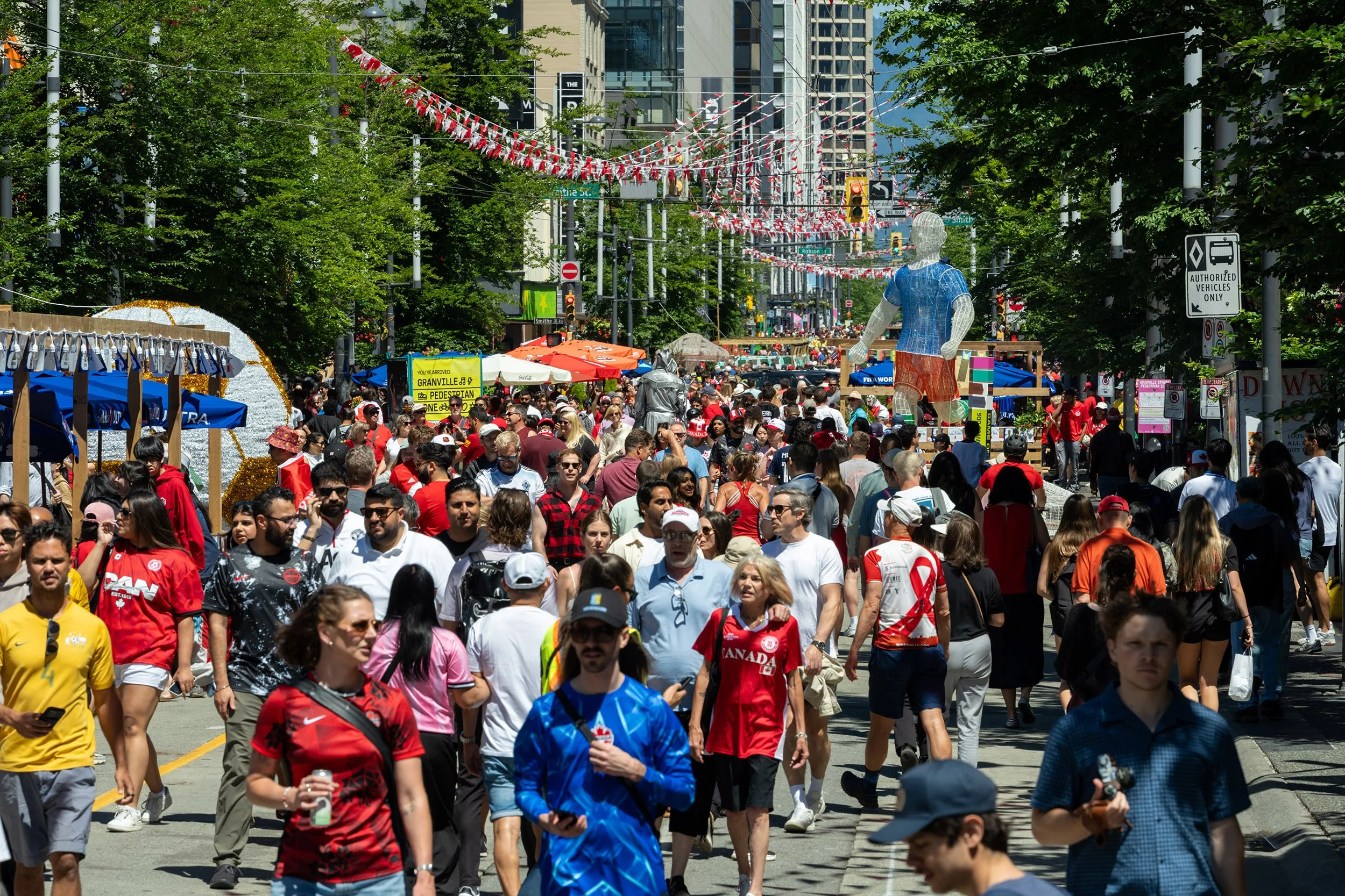 Fans gather along Granville Street in Vancouver during the 2026 FIFA World Cup. Sample image from a Sony FE 50-150mm f/2 GM and Sony A7 V.