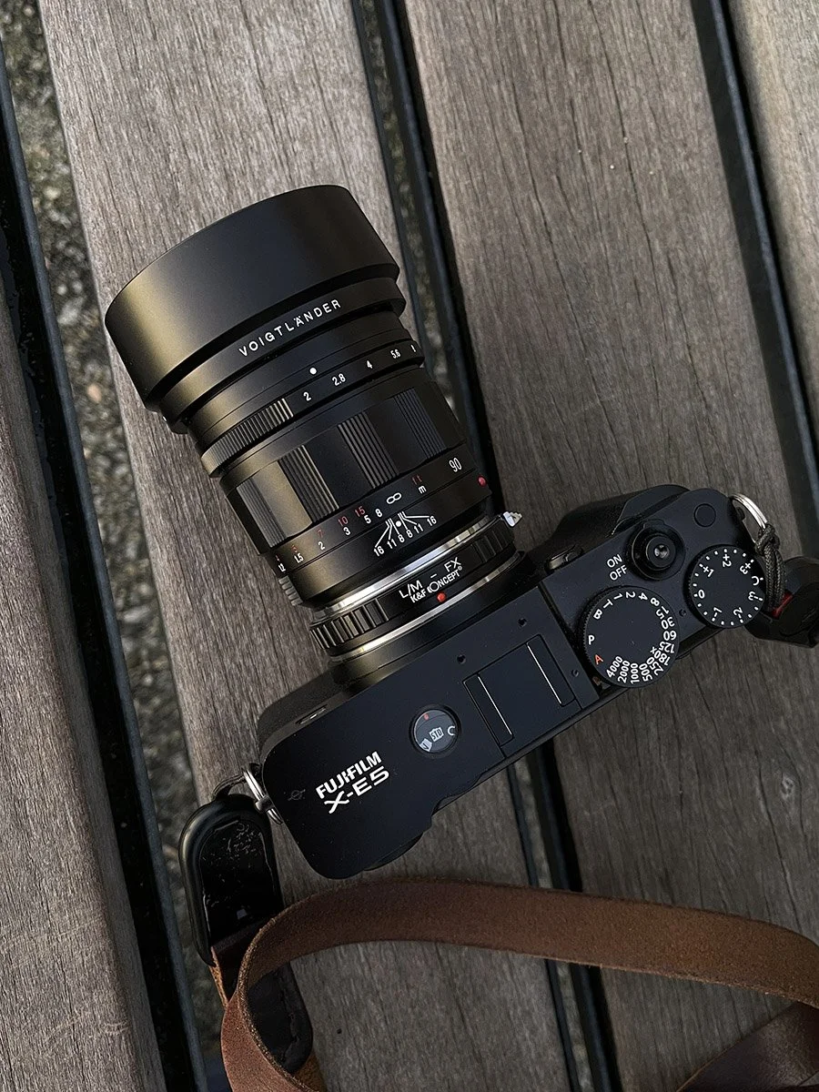 Fujifilm X-E5, black, and Voigtländer APO-Ultron 90mm f/2 VM