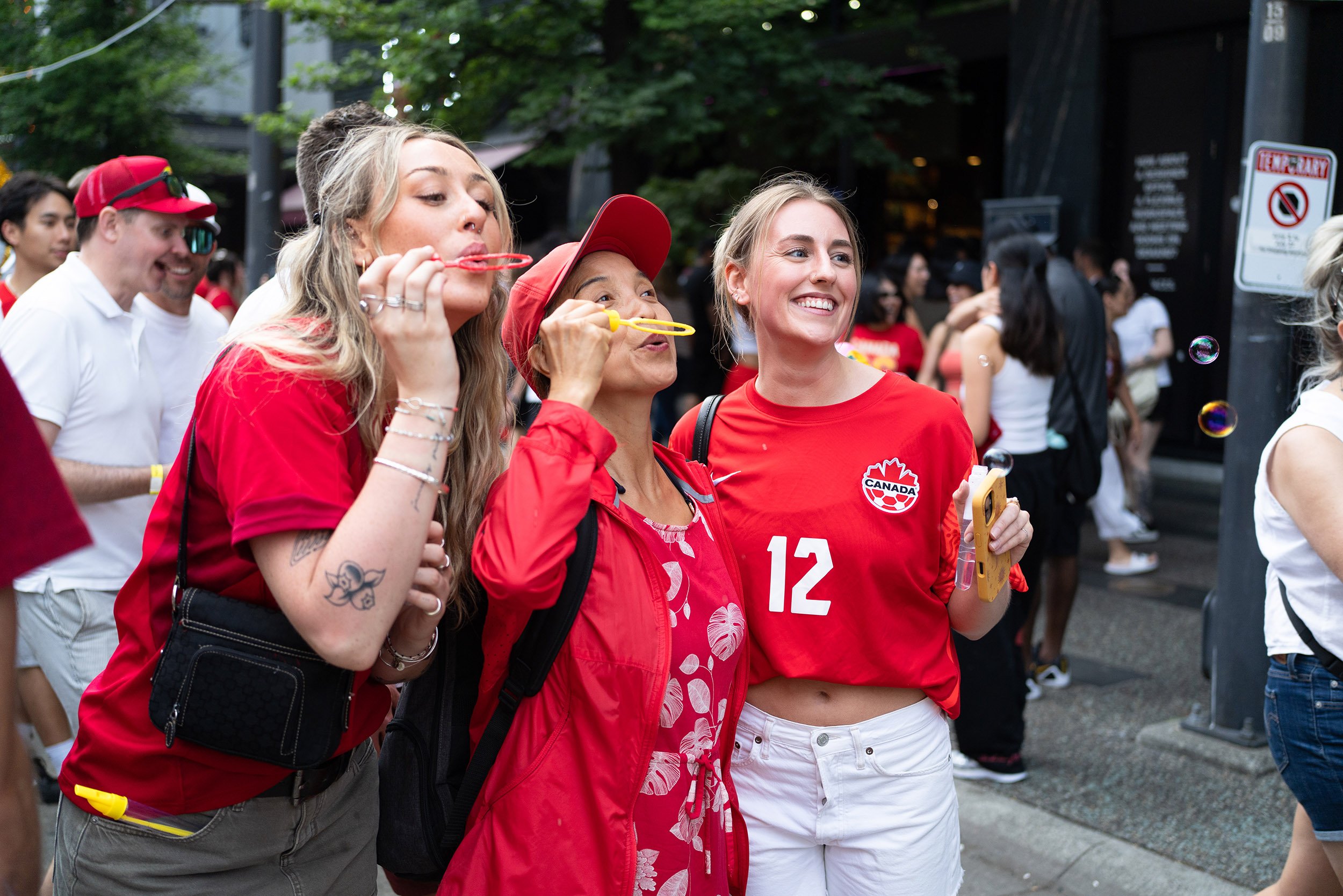 Canada soccer fans on Granville, Vancouver. Sample image from a Sony FE 40mm f/2.5 G and Sony A7 V.
