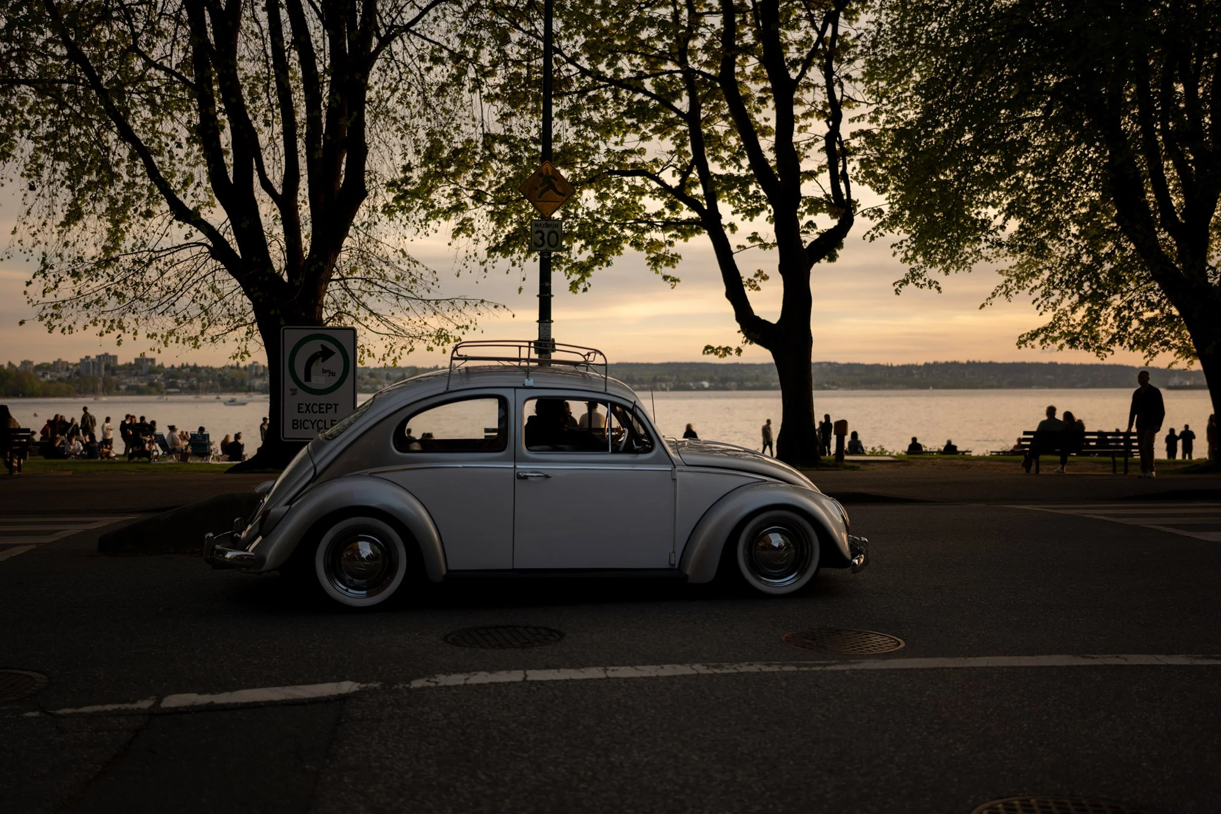 An old VW drives along Beach Drive in Vancouver