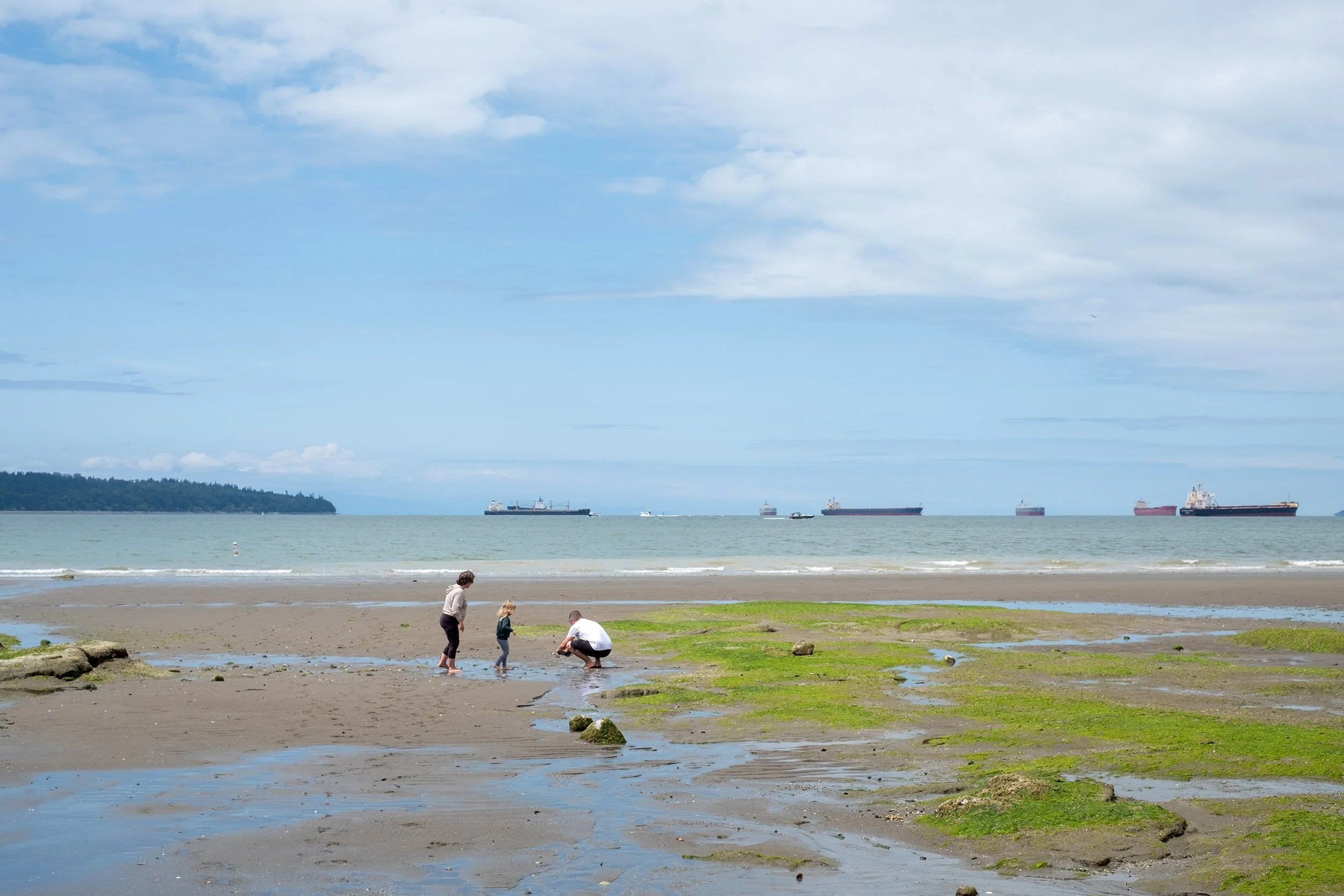 June at second Beach in Vancouver, family exploring