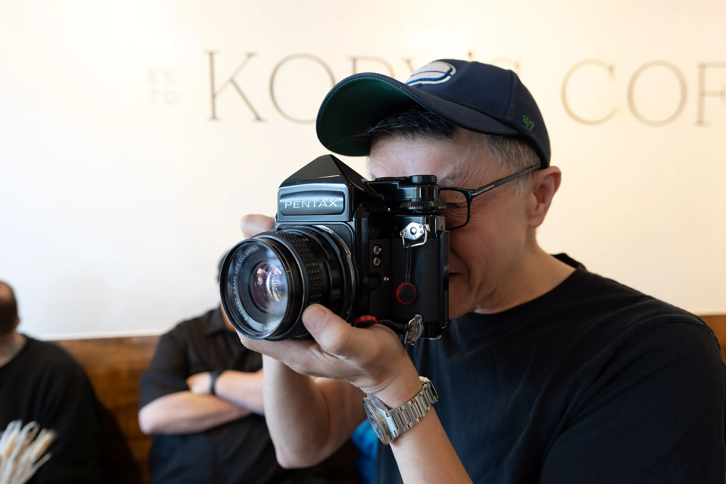 Ray sporting an old Pentax 6x7 film camera
