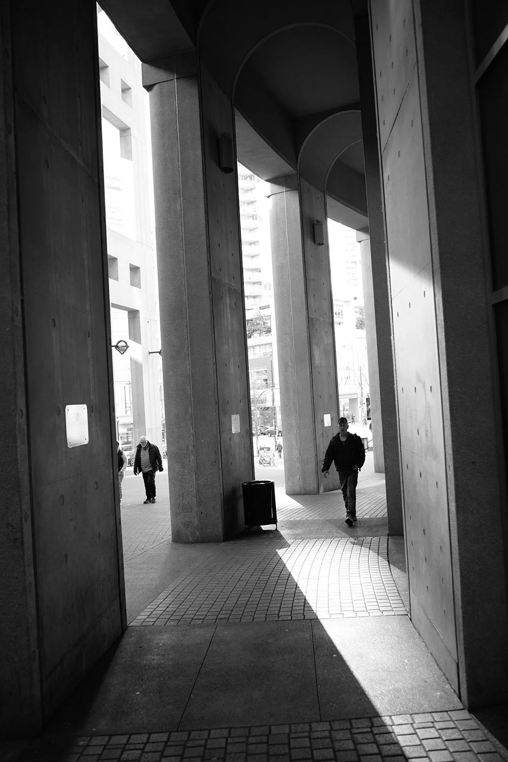 People walking outside the Vancouver Public Library. Sample image from a Voigtlander Nokton Vintage Line 28mm f/1.5 Aspherical and Nikon Zf.