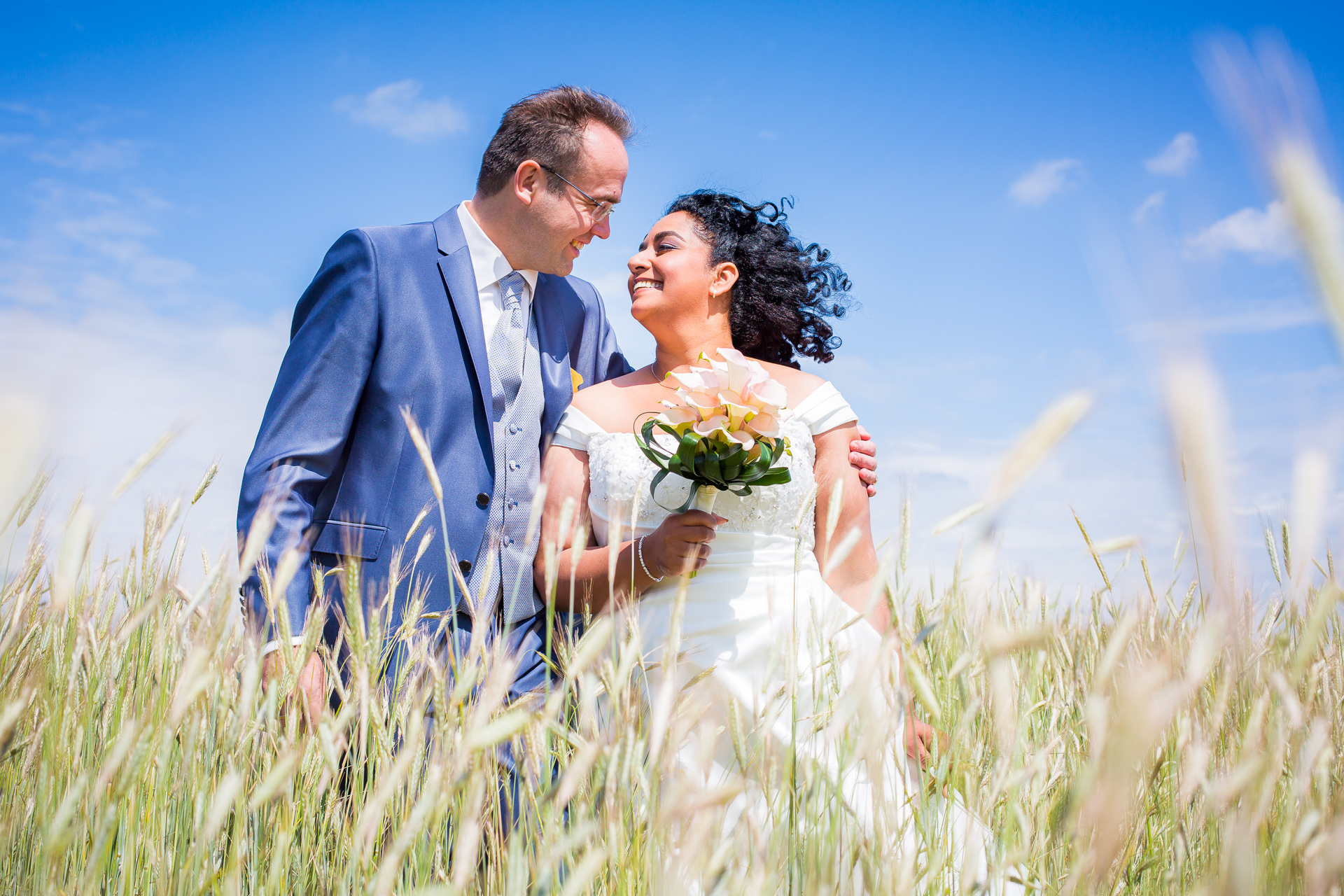  Wedding couple enjoying their photoshoot in the Dutch wheat fields     May, 2015   