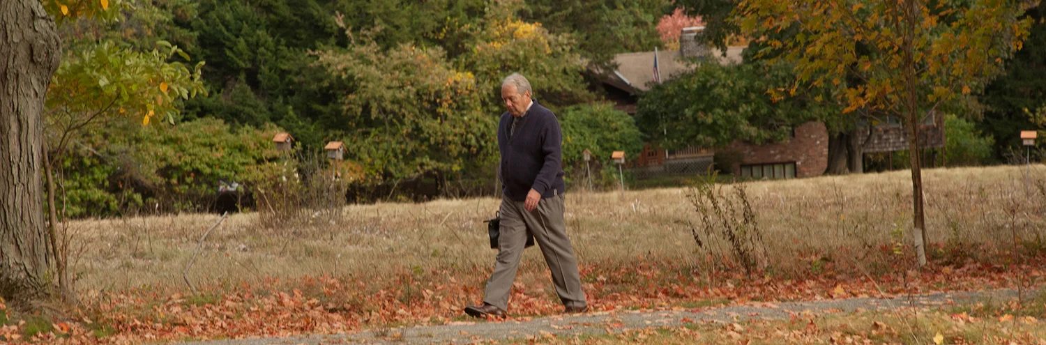 Dr. Brent Spears walks across a field.
