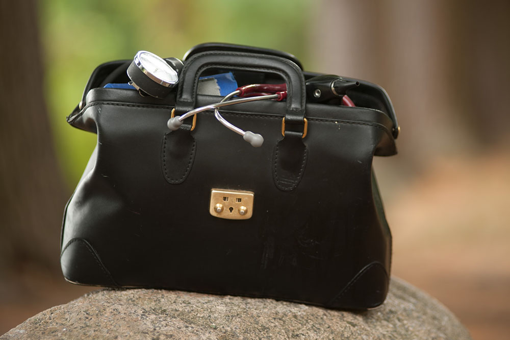 Black doctor's bag out doors