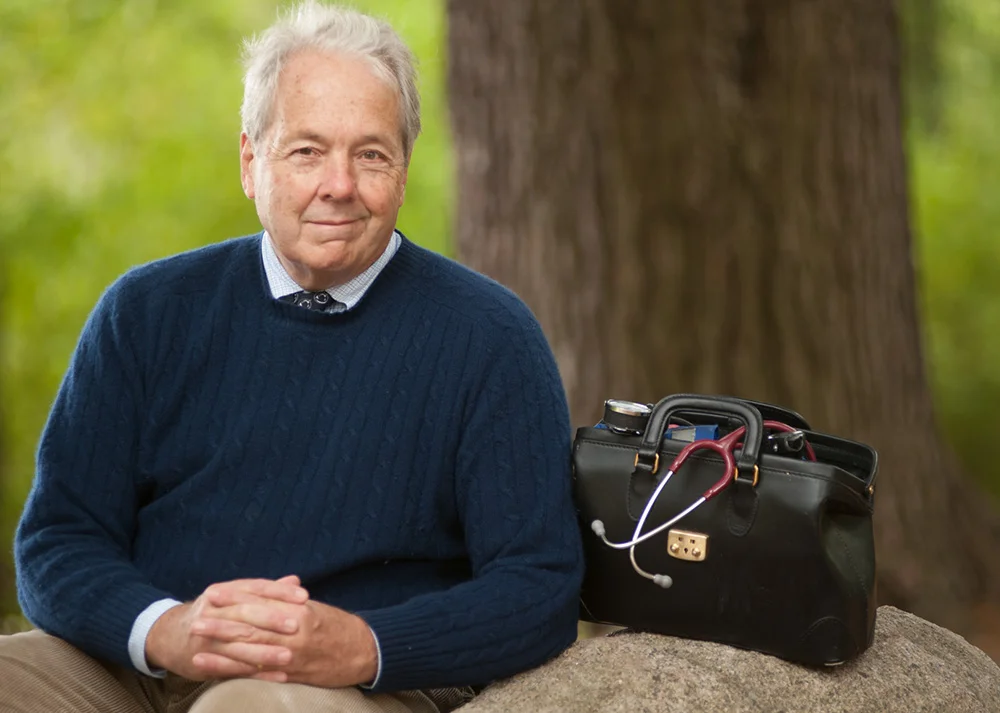 Dr. Brent Spears with doctor's bag outdoors.