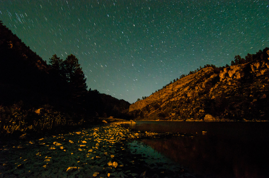  Stars streak as the earth turns during a long exposure along the Missouri River as light from Hauser Dam reflects off the canyon walls and the rocks dotting the bank. Missouri River, 2013 