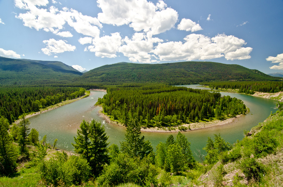  Facing west, the South Fork of the Flathead River bends greatly as it flows south out of Hungry Horse Reservoir. The spectacular beauty of Flathead National Forest and the Mission Mountains surround this area just south of Glacier National Park. Sou