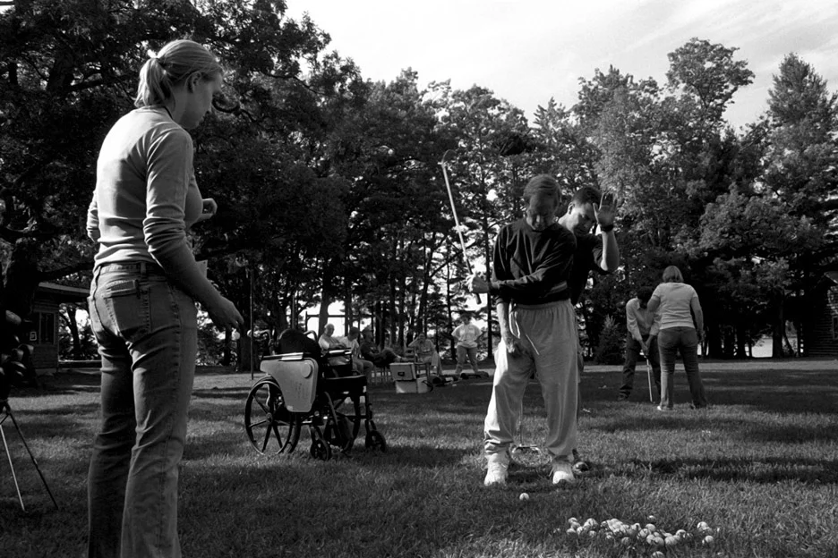 My dad swings a golf club while attending 'Aphasia Camp.' Put on by the University of Wisconsin-Eau Claire's communication sciences and disorders department, the camp is held annually and is organized to provide opportunities for people with aphasia to practice their communication skills and participate in meaningful activities in a supportive setting. September 2007.