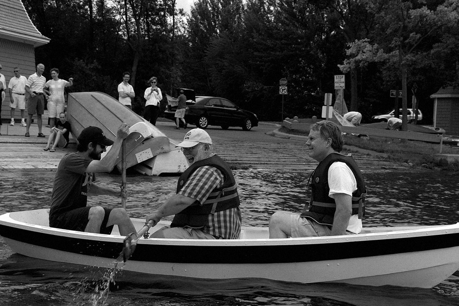 From left, my brother Jimmy, Greg Schaffner and my dad row around in the boat they all helped build. August 12, 2010.