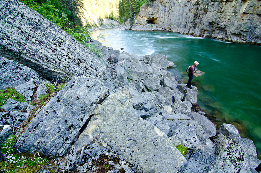 Kurt Ross quickly strips line as he swings a streamer through a hole on the South Fork of the Flathead River near Glacier National Park in Montana while fly fishing for bull trout in June 2013. 