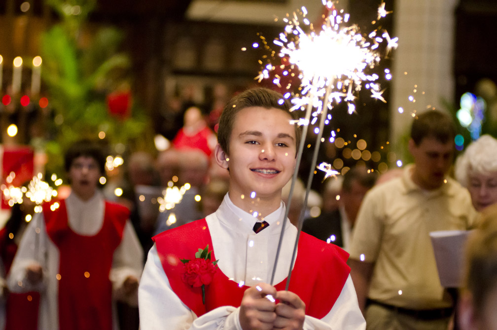 Daniel Peterson, 14, of Minneapolis, walks with a sparkler at the conclusion of service in celebration of being confirmed at Central Lutheran Church in Minneapolis, Minn., Sunday, May 19, 2013.