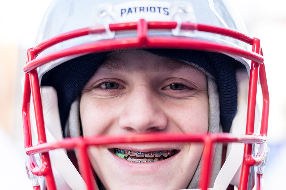 Silas Roy, 13, poses for a portrait on Nicollet Mall in Minneapolis, Minn., on Thursday, Feb. 1, 2018. Roy was out with friends and family in the frigid cold, wearing just sweat pants, a sweatshirt, mittens, a Tom Brady jersey, and his Patriots helm