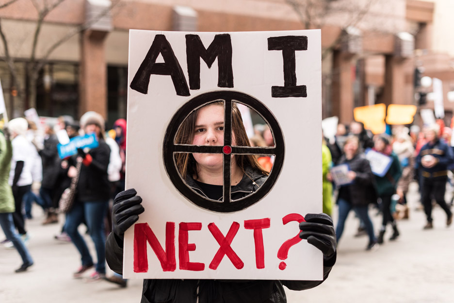 Greta Dembroski, 18, a freshman at the University of Minnesota, poses for a portrait during the March For Our Lives anti-gun violence protest in St. Paul, Minn., Saturday, March 24, 2018. “I’m not gonna accept that our legislation is gonna provide a
