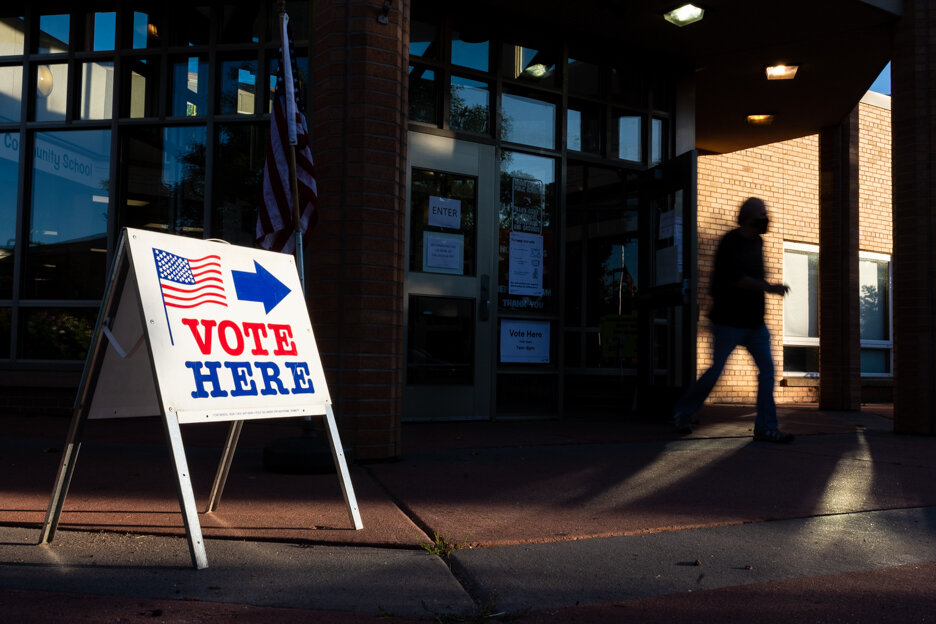 A voter exits Bryn Mawr Elementary School in Precinct 7 after voting in the primary in Minneapolis, Minn., on Tuesday, Aug. 11, 2020.