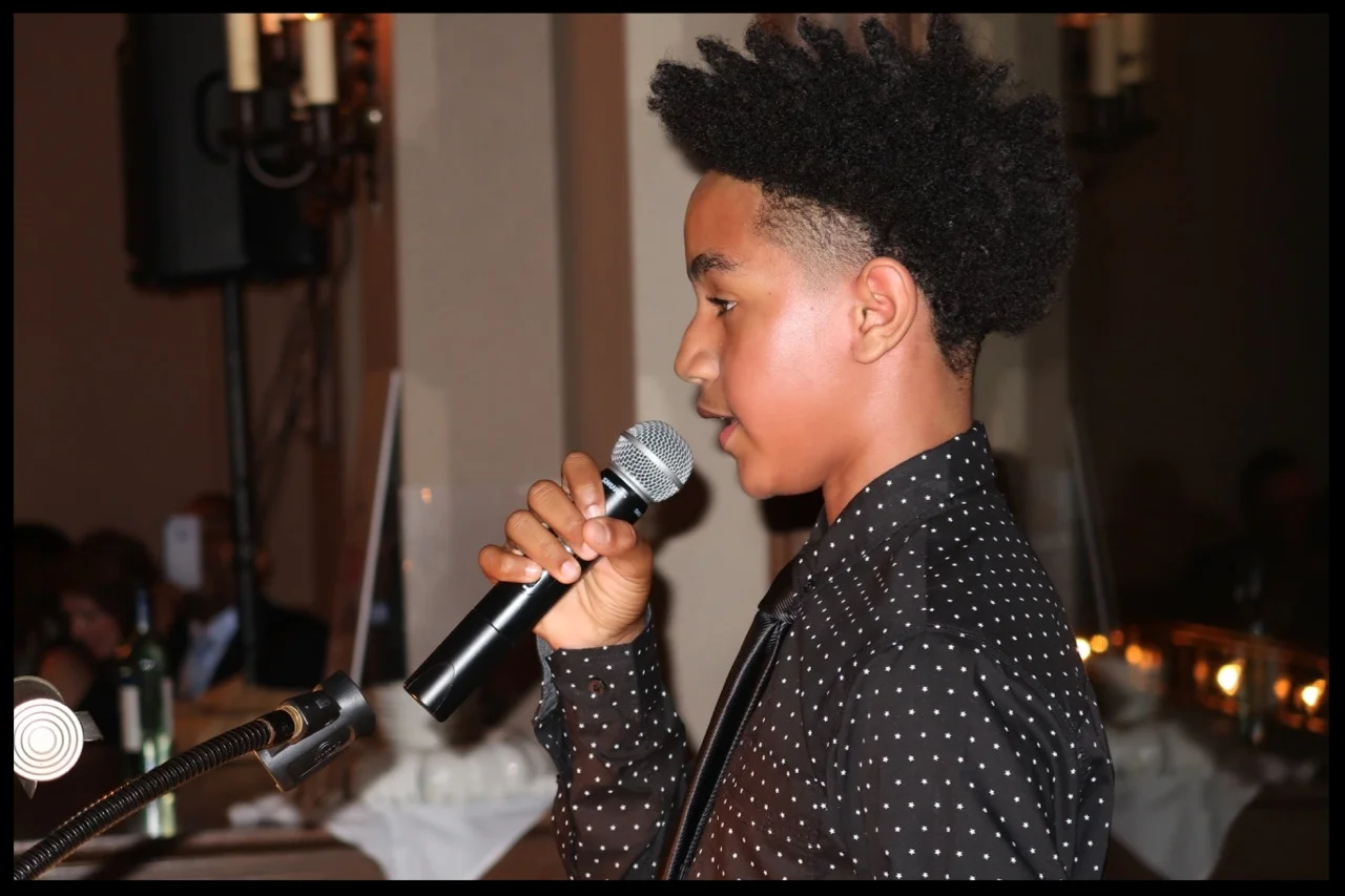 Raji Davenport, a SquashDrive alumnus, closing the evening with his account of SquashDrive and its impact on his life. (Photo Courtesy of Juliet Lamont.)