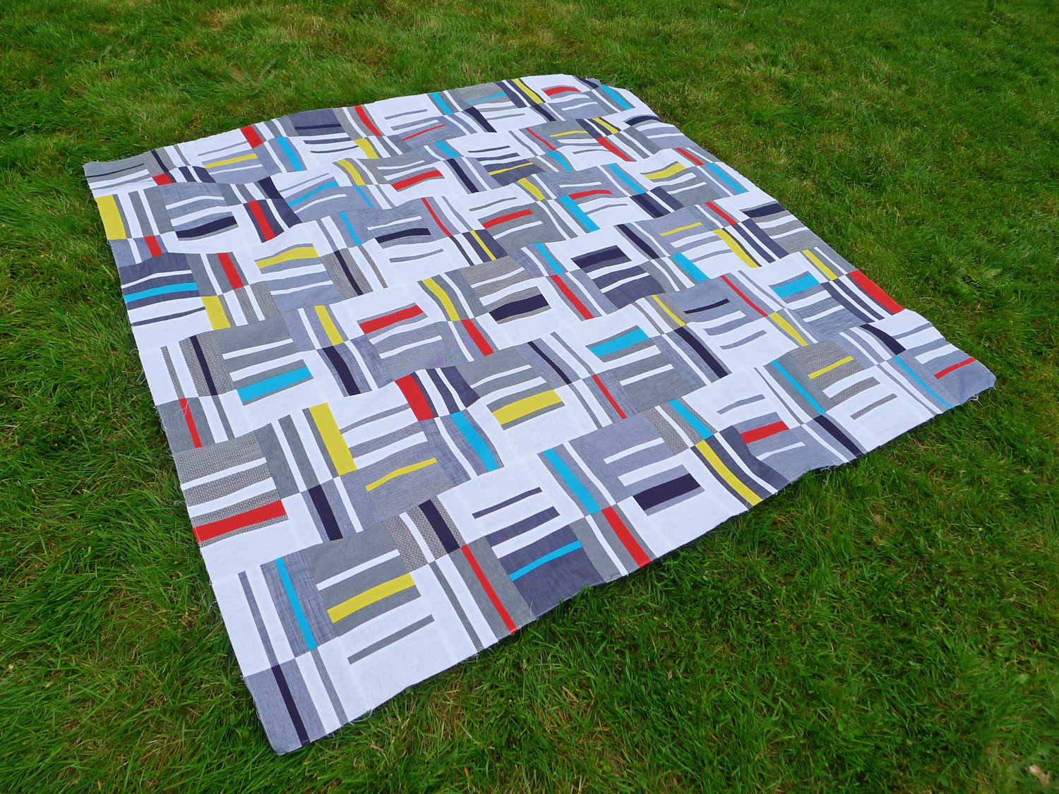  Knee Socks quilt top by Elizabeth Hartman, featuring Robert Kaufman's Chambray Union and Kona Cotton. 