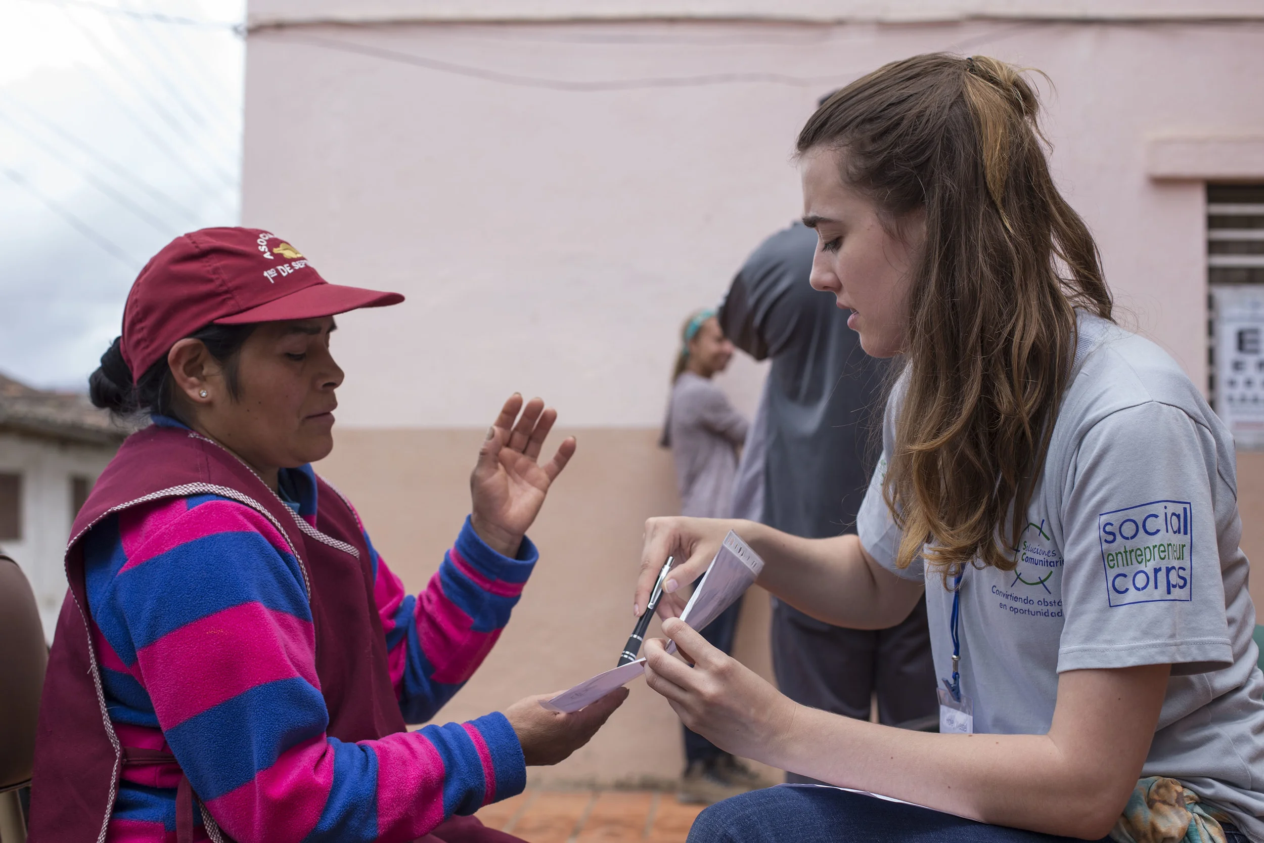 Haley conducting a close vision test with one of the women of Sig Sig.