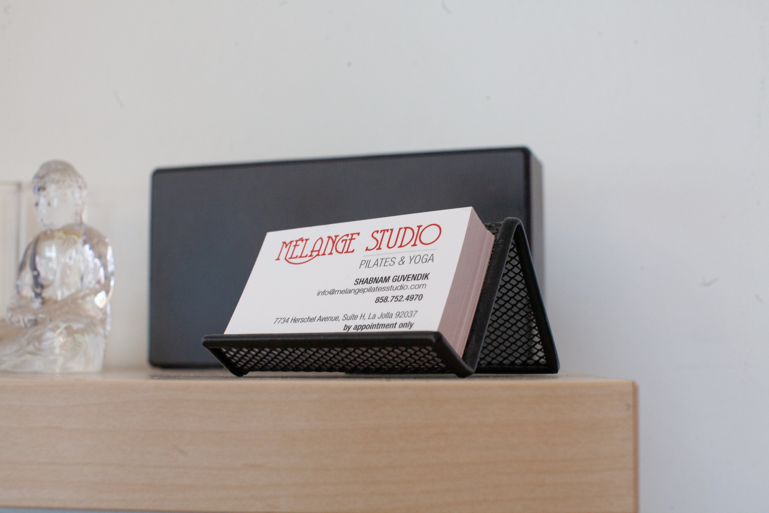 Business card of Melange Studio Yoga and Pilates