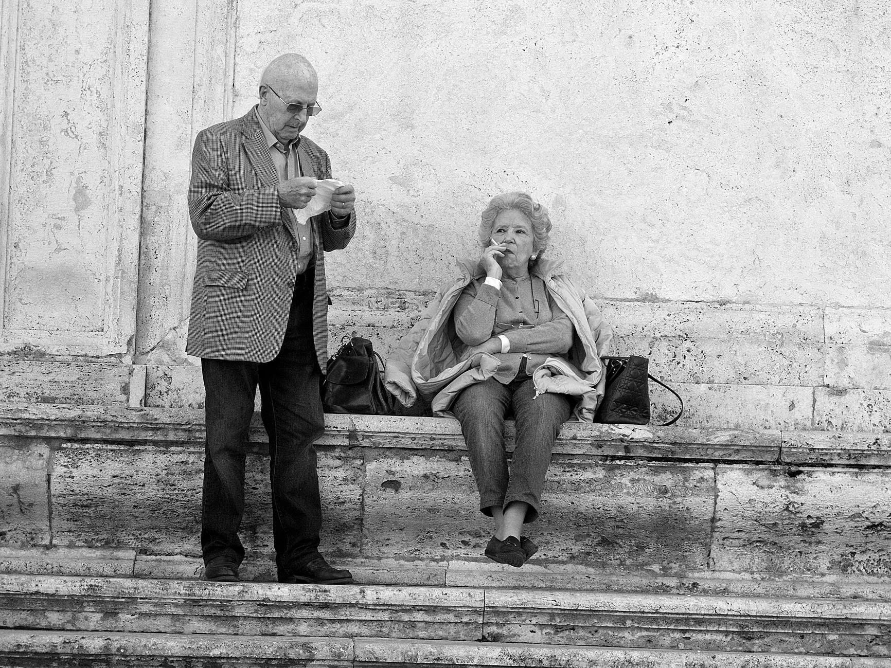 Old couple on the stairs of Viktor Emanuel monument