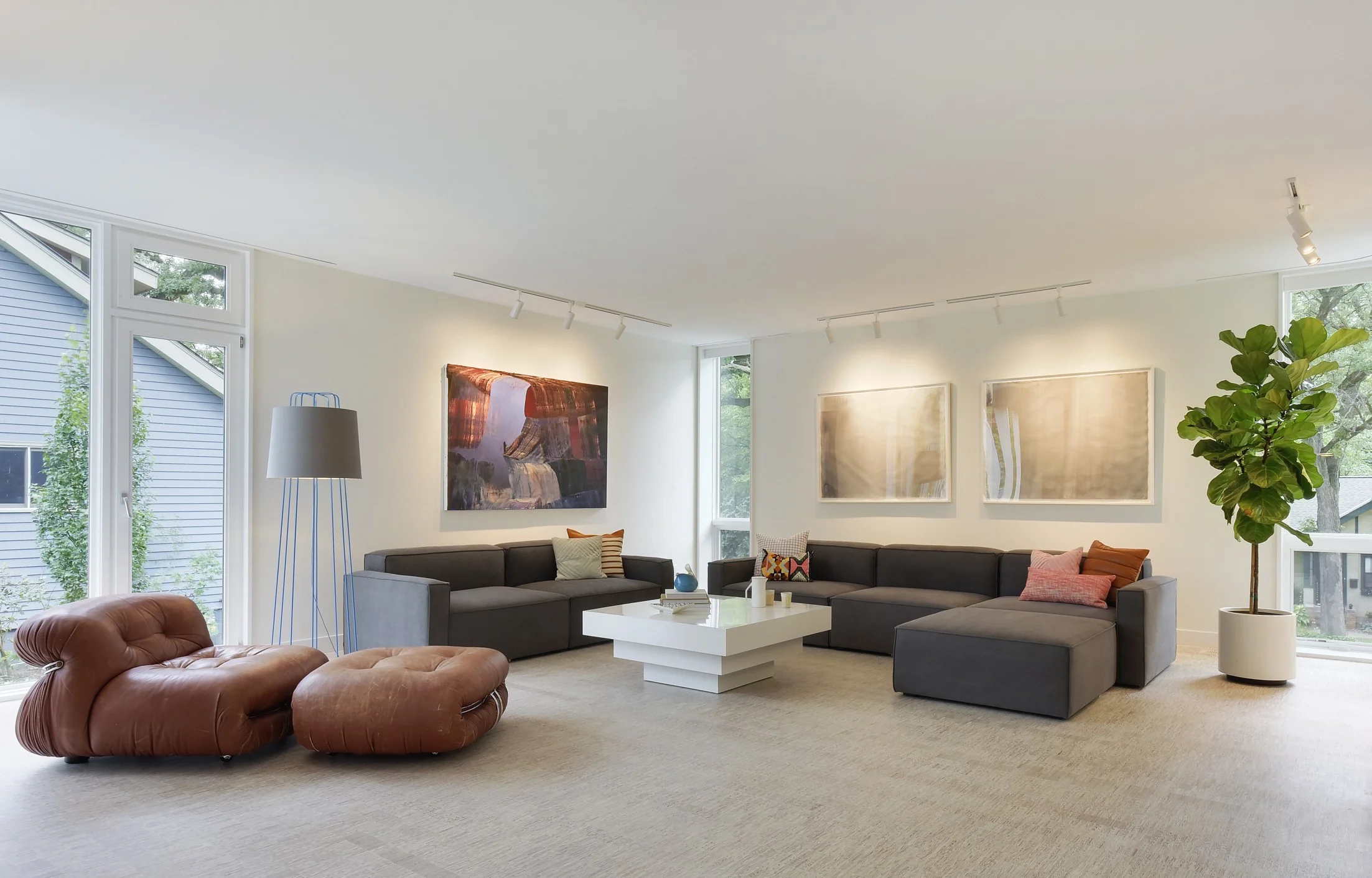 Vintage Chair sourced by FMW | Blu Dot Perimeter Floor Lamp | Painting by Jeremy Szopinski (L), Prints by Tetsuya Yamada (R) | Mix Modular Sofa by Gus | Coffee Table from Retro Wanderlust