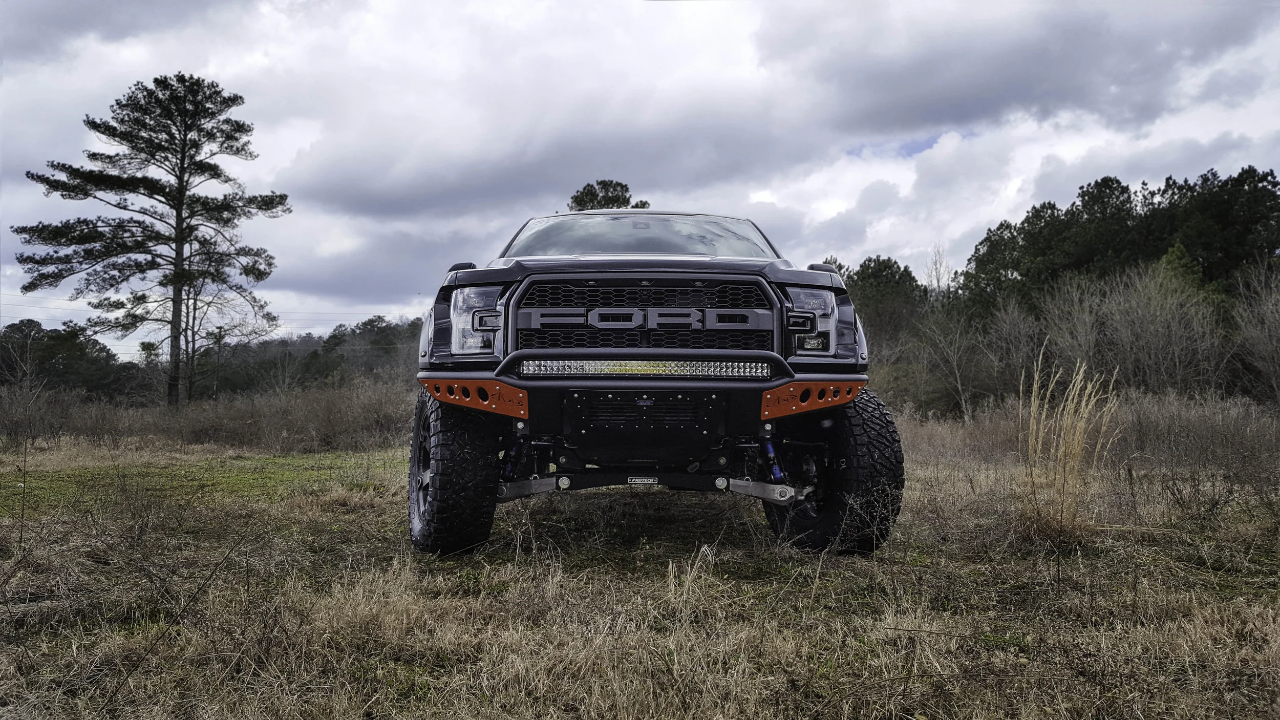 Ford Lifted Raptor Red Front.jpg
